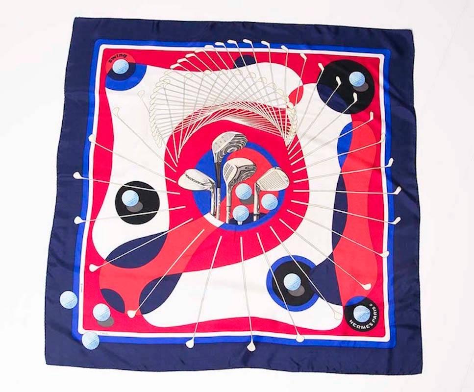 Silk  square Hermes scarf with print by Julia Abadie, dedicated to golf. 
Golf elements are golf balls and golf clubs. 
Main colors are tones of blue, white and raspberry red. 
Ideal for woman who love to look stylish on the golf course or have a