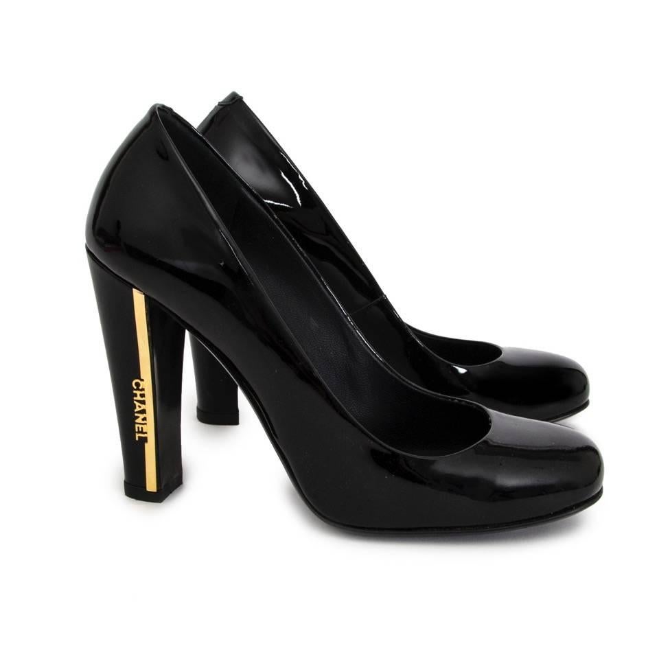 Chanel black patent leather pumps with block heel. 
The heel features a gold Chanel logo on the side.
Size 36.