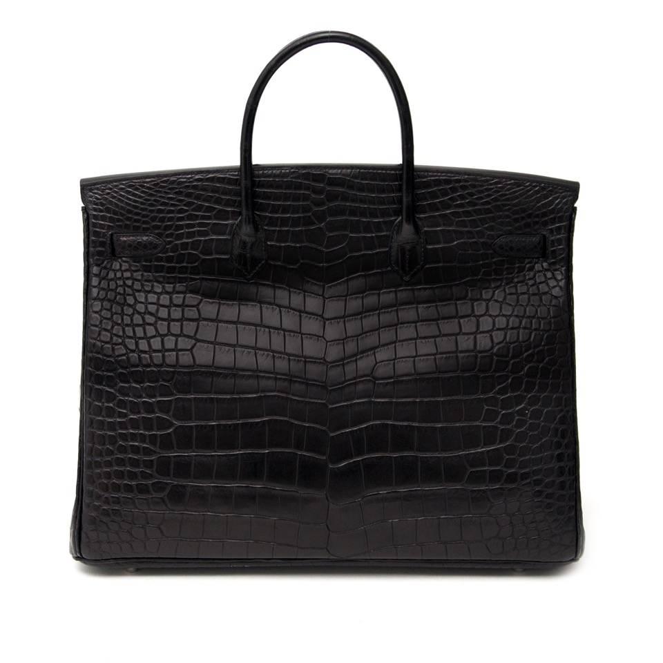 Hermes Birkin 40Cm In The Most Beautiful Crocodile Porosus Matte Black With palladium hardware. One of the most amazing and timeless colors.
Plastic still on the hardware, receipt and cites included. Blindstamp R in a square.
Porosus Crocodile is