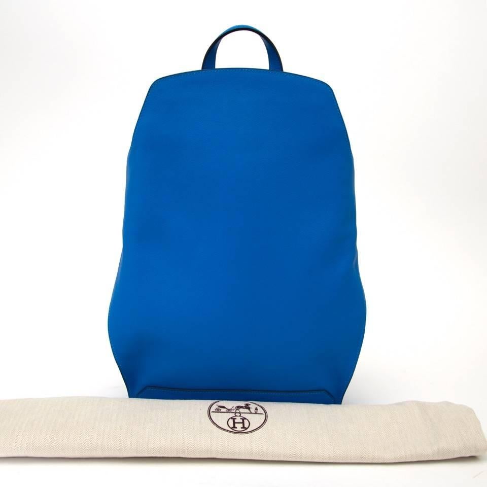 Hermes backpack in Gorgeous Blue Hydra with Palladium Hardware. This chic tote is crafted of luxurious evercolor calfskin leather, which is lightweight yet durable. Beautifully shaped adjustable straps and top handle. Side design detail with