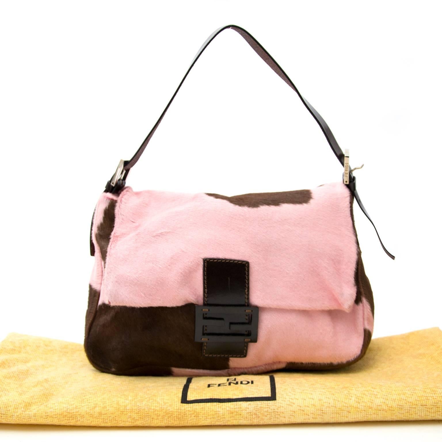 Excellent preloved condition

Fendi Medium Pony Hair Baguette

Pink and brown printed ponyhair Fendi baguette with silver-tone hardware, brown leather trim, flat shoulder strap with buckle adjustments, brown satin interior lining, single interior