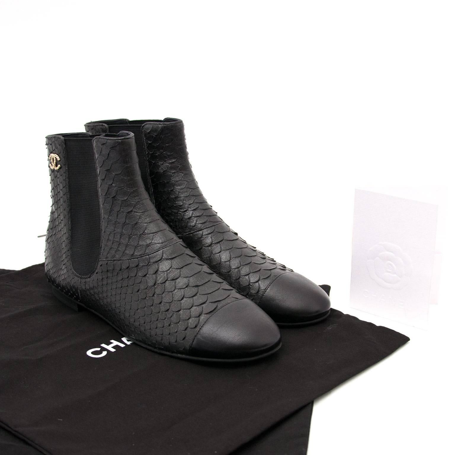 Chanel Python Ankle Boots

These beautiful Chanel ankle boots feature elastic at the shaft, making these easy to put on and to walk around on all day. The python leather is the epitome of luxury, and the CC logo on top of the boot is subtile yet