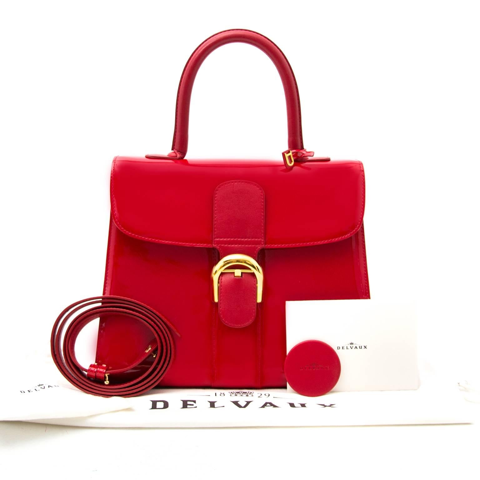 The Brillant, definitely a classic of all times. Designed in 1958 and stil on trend today. 
Crafted out of red patent leather with gold-tone details.
The Brillant comes in the medium size, perfect to wear on a daily base. 
Close this bag securely