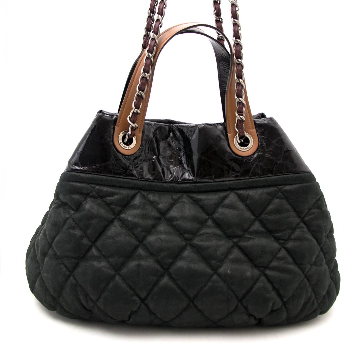 Chanel Black In The Mix Large Tote Bag
The Chanel In The Mix was first released during Chanel's Fall 2010 collection. 
The bottom has an interesting quilted base that appears wrinkly and a sturdy leather upper half.
 
This purse expands at the base