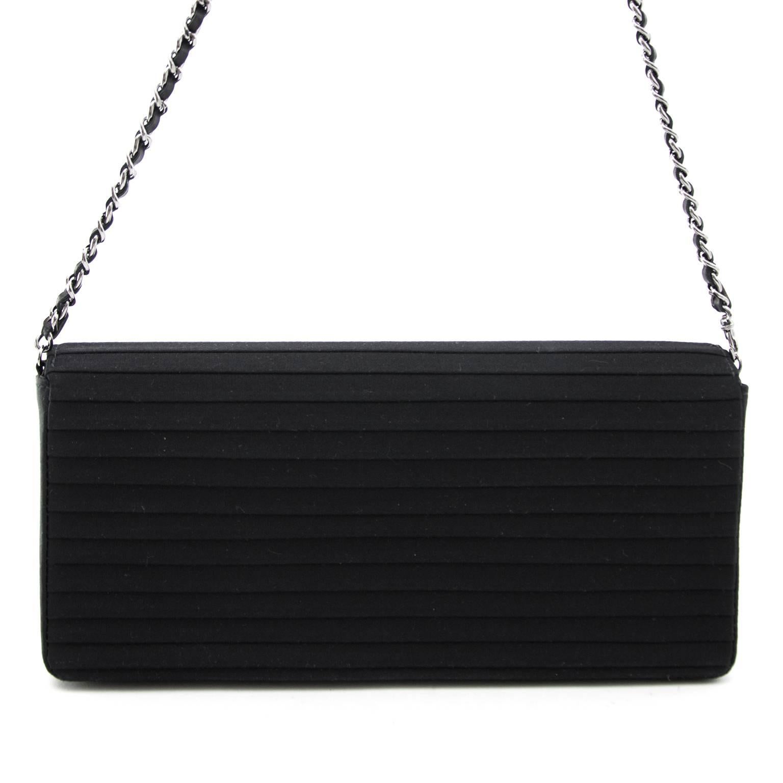 The ultimate night bag, this Chanel Black Clutch Bag Striped Fabric. The strap makes it possible to wear the bag on your shoulder or you can wear it as a clutch. The bag has enough space for your phone, makeup bag, wallet. The ultimate item to
