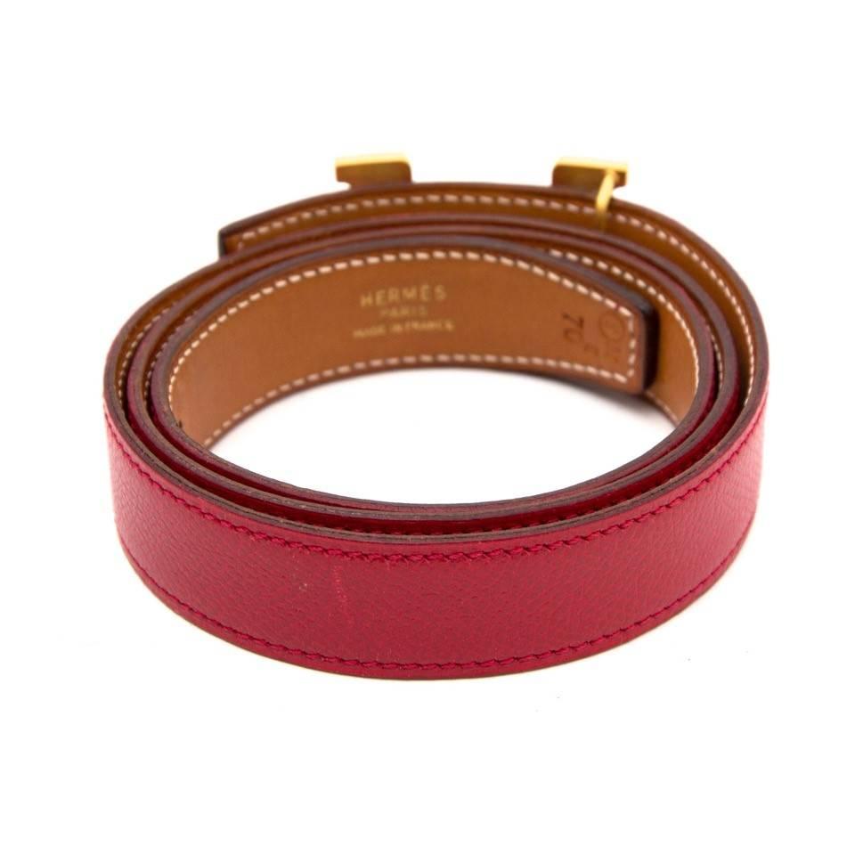 Beautiful red leather belt by Hermès with elegant gold toned H.
