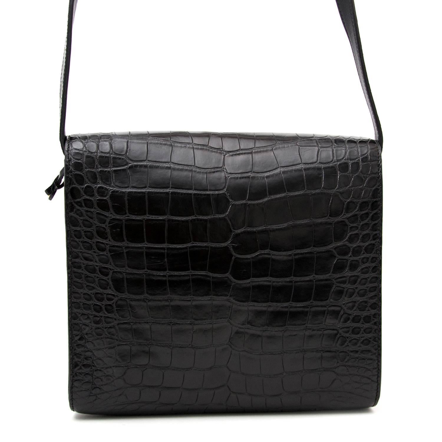 Delvaux Black Croco Crossbody Bag 
Timeless black Delvaux piece in croco leather. 
Perfect to keep all your essentials in an elegant way.
Practical adjustable strap. 
Gold toned lock closure with engraved Delvaux emblem. 
Comes in with original
