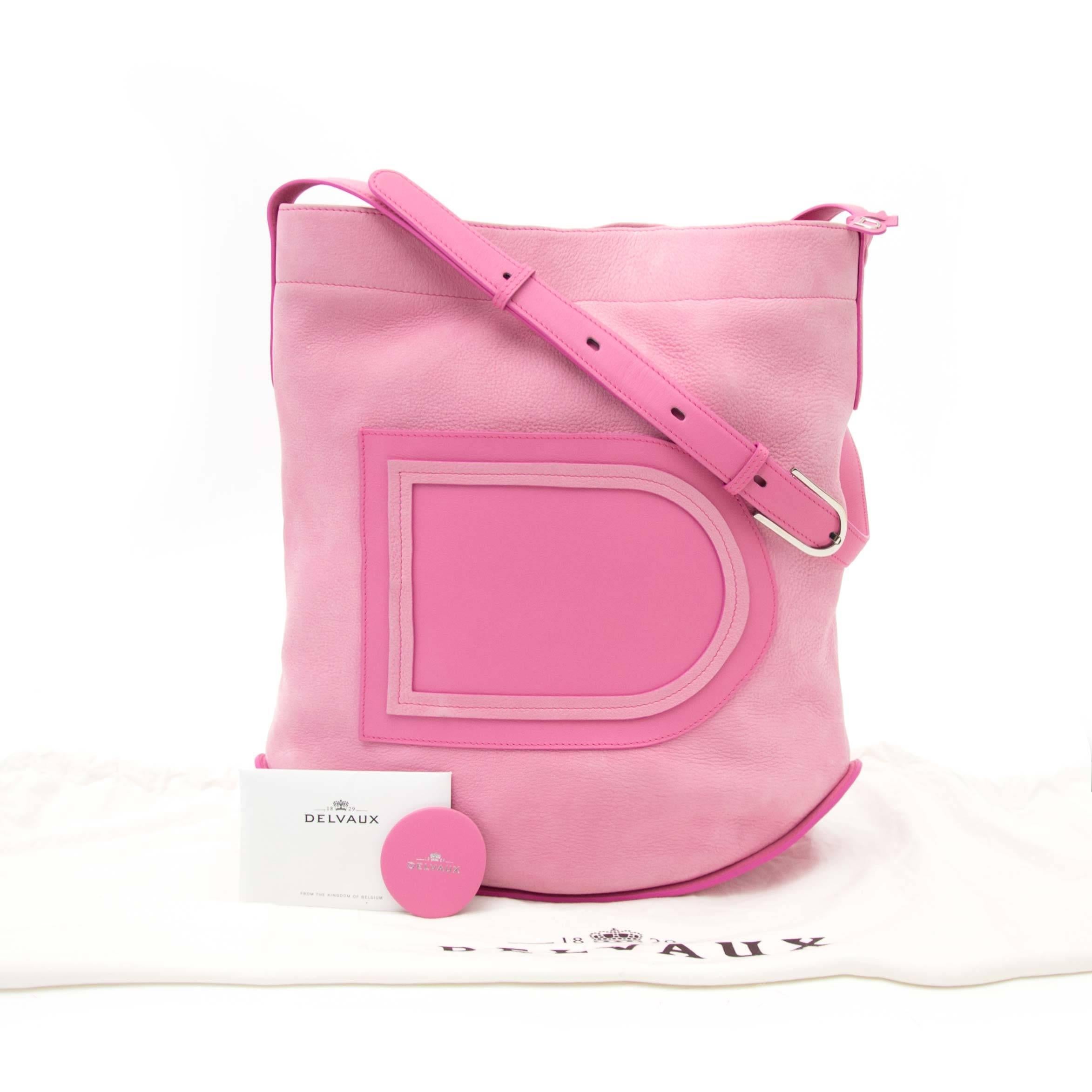 Excellent Preloved Condition

Estimated retail price €1650,-

Delvaux Flamingo Rose Allure Nubuck Le Pin  

This classic Delvaux shoulderbag comes in an elegant rose allure nubuck  leather and features the iconic Delvaux logo.
The Pin has a curvy