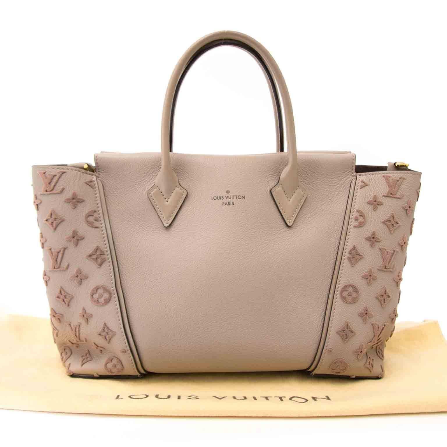 excellent preloved

est retail price €3200,-

Louis Vuitton Veau Cachemire Tote W PM Galet

The Louis Vuitton W Bag gets its name from the unique ‘W’ design of the bag, created by using two separate materials. The expansive sides of flocked monogram