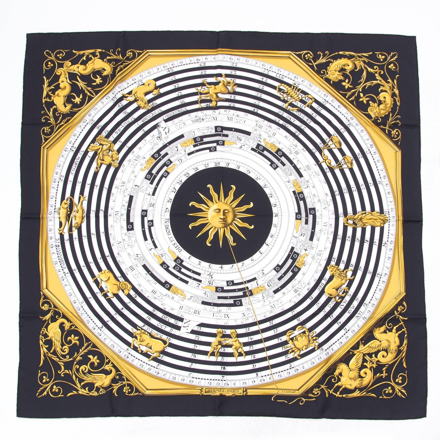 This is an authentic Hermès 'Carré' scarf, 100% silk with a beautiful classic Calendar & Horoscope theme print. Elegant cream color with black trim with yellow print.