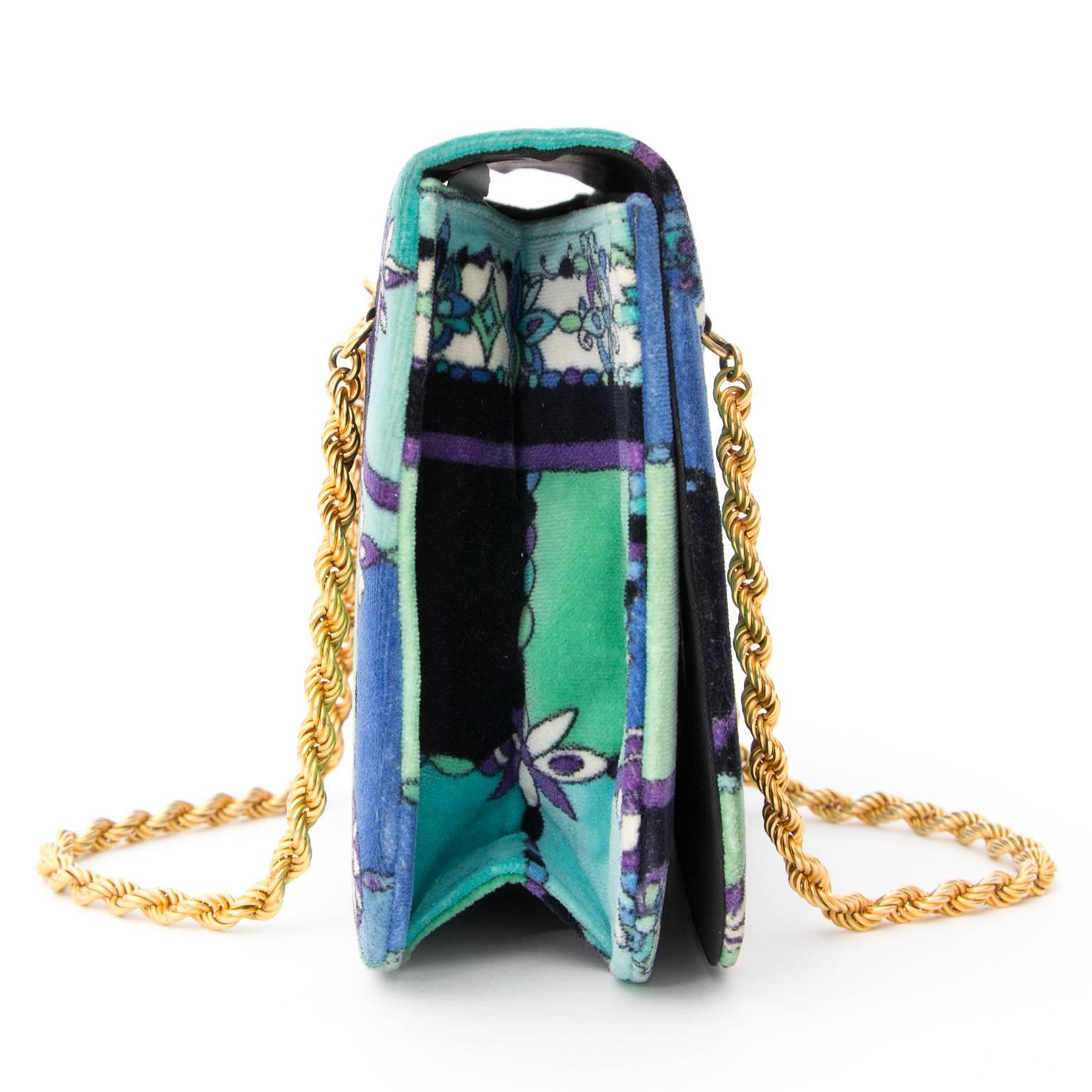 Chic Emilio Pucci Evening Bag with amazing colourful design. 
The combination of turquoise, blue, purple and green make this beauty a little piece of art. 
The bag is in good condition. The interior is black with a small pocket on the inside.