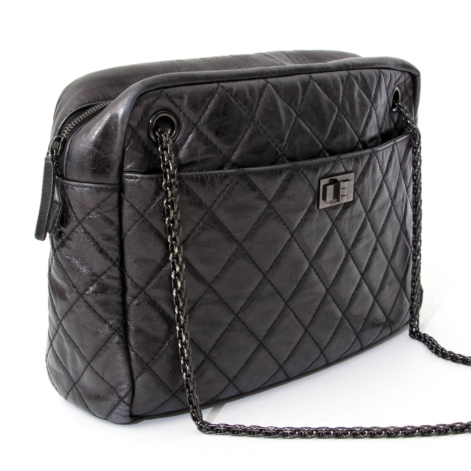 Go glam with this gorgeous and timeless black Chanel Reissue Camera Bag. It is made of black distressed quilted calfskin and features gunmetal hardware, Mademoiselle turnlock and exquisite chain straps. This versatile bag is perfect for everyday use