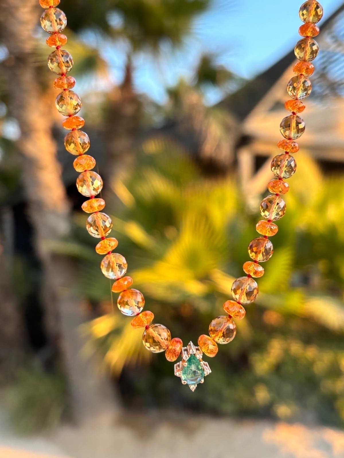 A sparkling giant citrine necklace with extremely rare and pure spessartine garnets. This necklace features genuine high grade bright yellow citrines, delicately strung together with spessartine garnets, zambian emerald, diamonds and solid gold