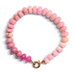 Bracelet en or jaune perlé de saphirs roses et d'opales