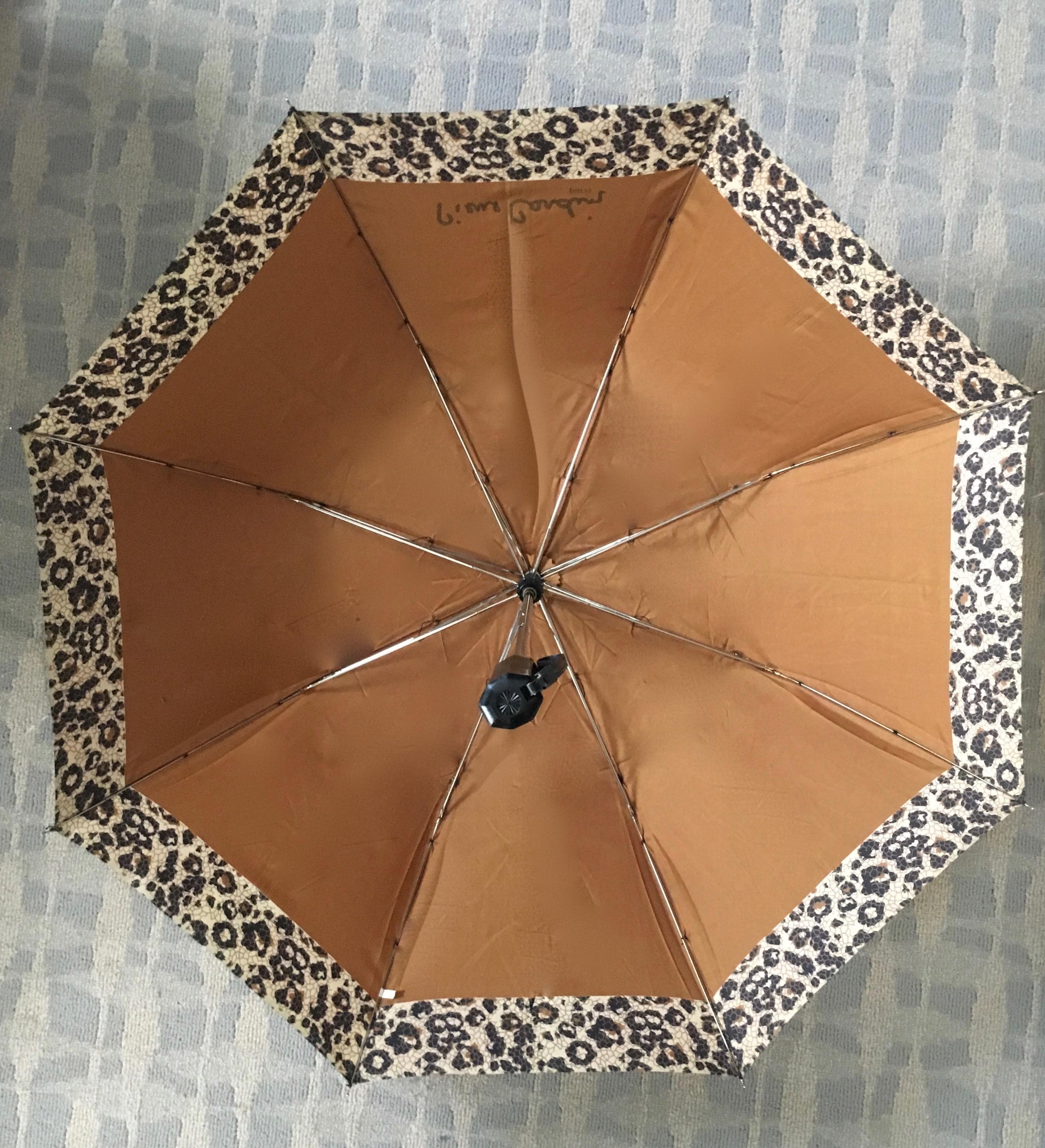 Pierre Cardin Vintage Umbrella with Leopard influenced design.  The umbrella is a portable and easy to carry automatic push button Umbrella, which still operates perfectly.  No damage, no cuts or damage and comes in original Pierre Cardin Case.

A