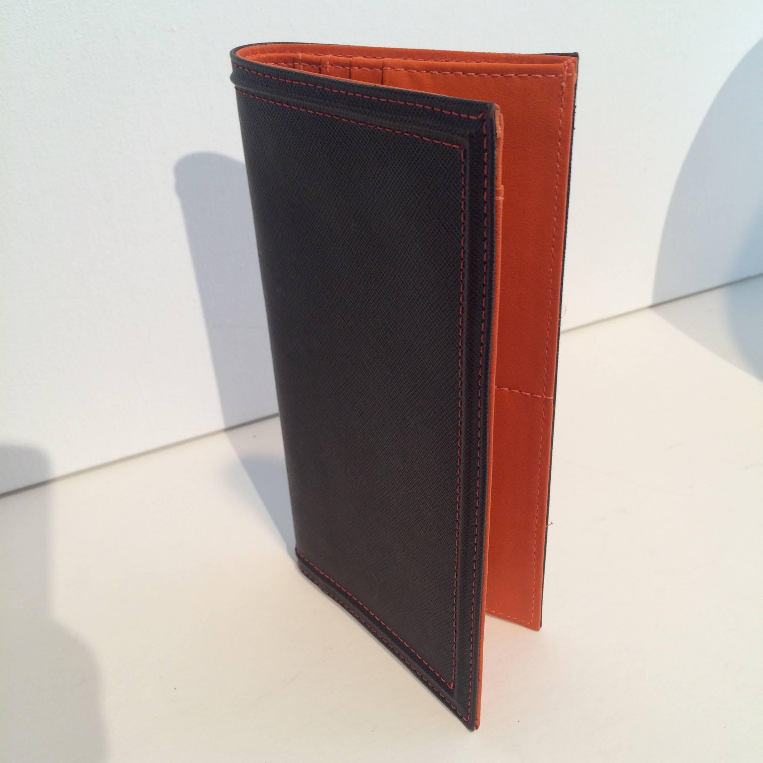 Never used Etro Wallet with stunning, typical Etro signature orange.  Holds 6 credit cards, papers and Check book