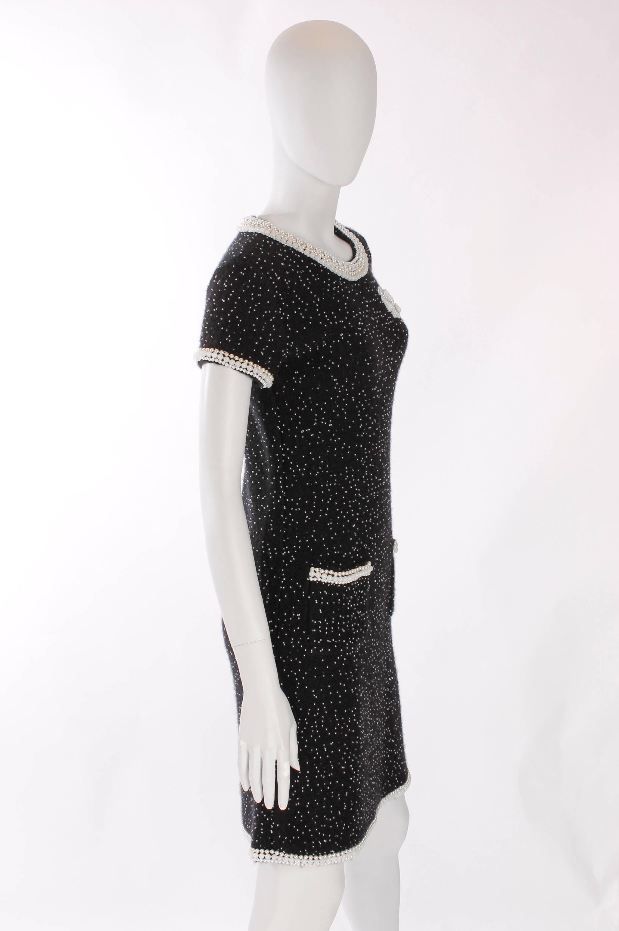 Very beautiful black Chanel dress made of cashmere, covered in tiny little pearls. This dress is a Chanel Runway Ready-to-Wear piece from the Autumn collection of 2006/2007. Limited edition!

Skirtlength on, or just above, the knee. This dress is