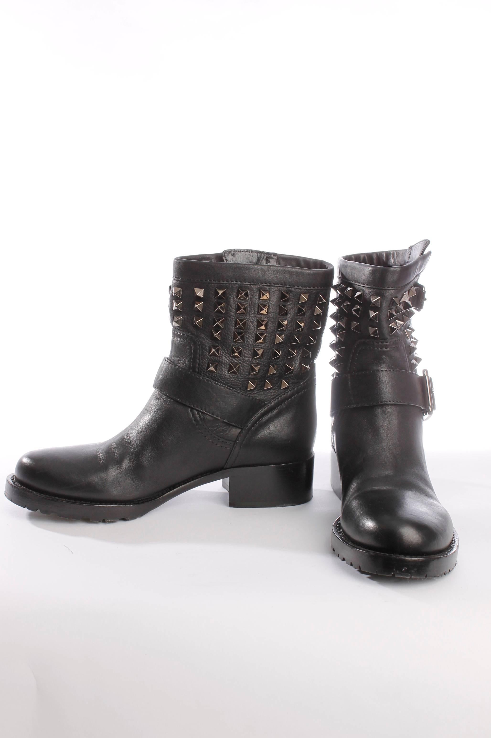 Like new! This super sought after Valentino biker boots are crazy! A short shaft filled with black/silver studs, a strap with buckle around the ankle and a small gespje at the top. Hot item! Valentino rocks!  Round toe and low heel of 3 centimeters.