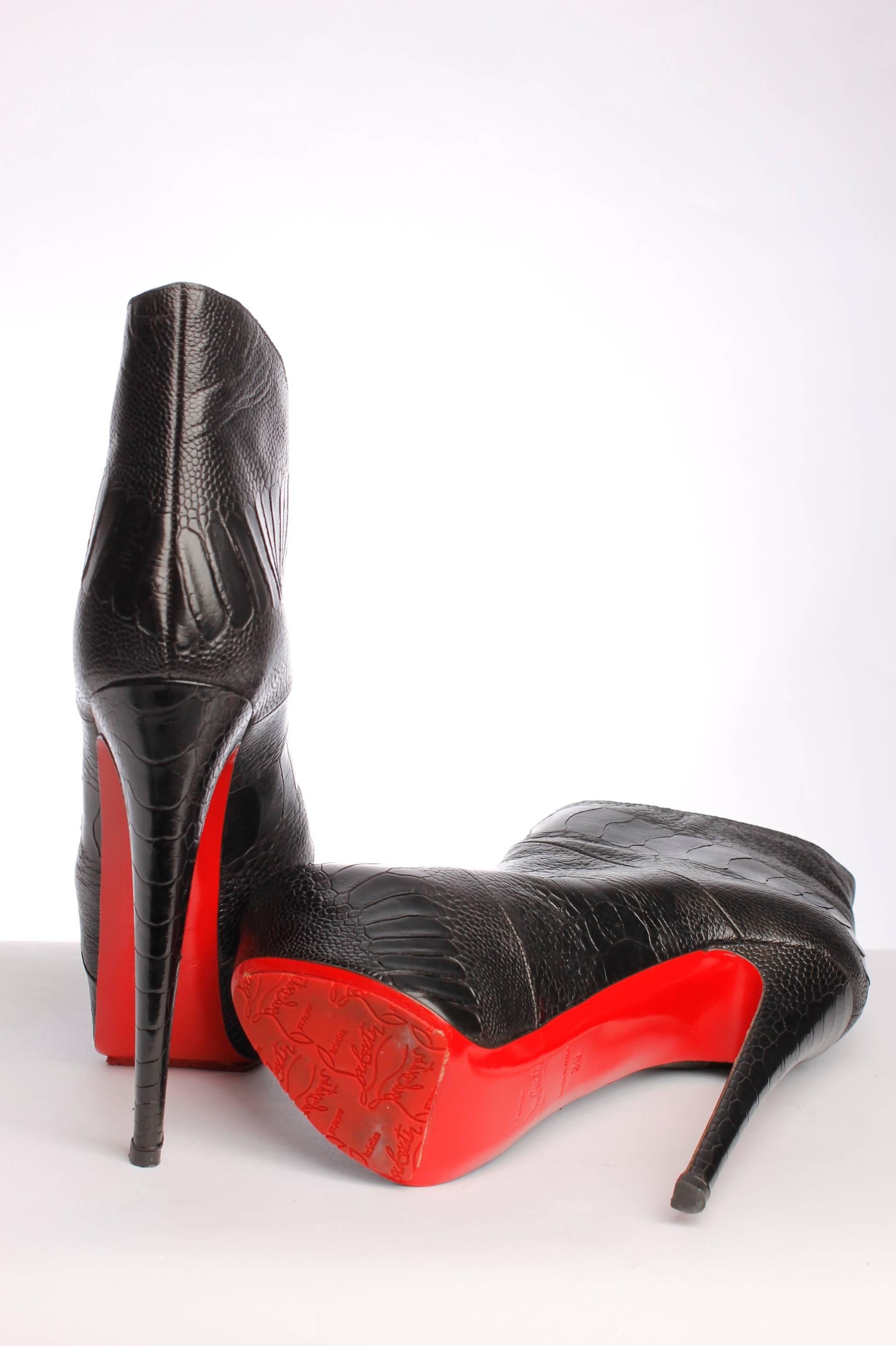  

Really high Christian Louboutin ankle boots in black croco-printed leather.

These boots are fully made of black croco leather with a little peep-toe. No zipper or other closure, easy to put on. The red sole is in good condition, a little