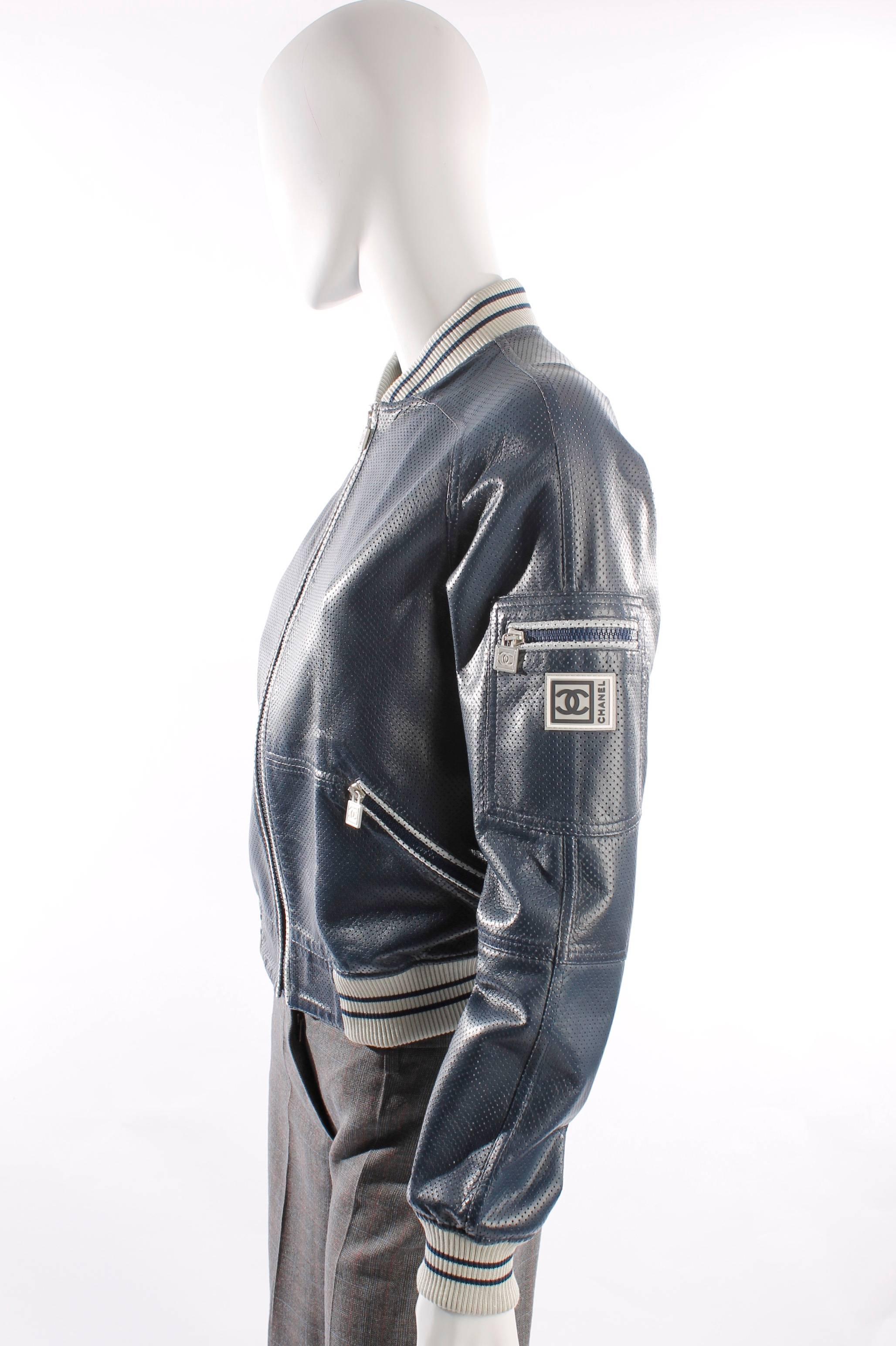 Very lightweight jacket by Chanel from the pre-fall 2005 collection in blue. It has silver and sandcoloured details.

The leather is pierced, this makes the coat very light and airily. When you hold the leather up into the light, it is kind of