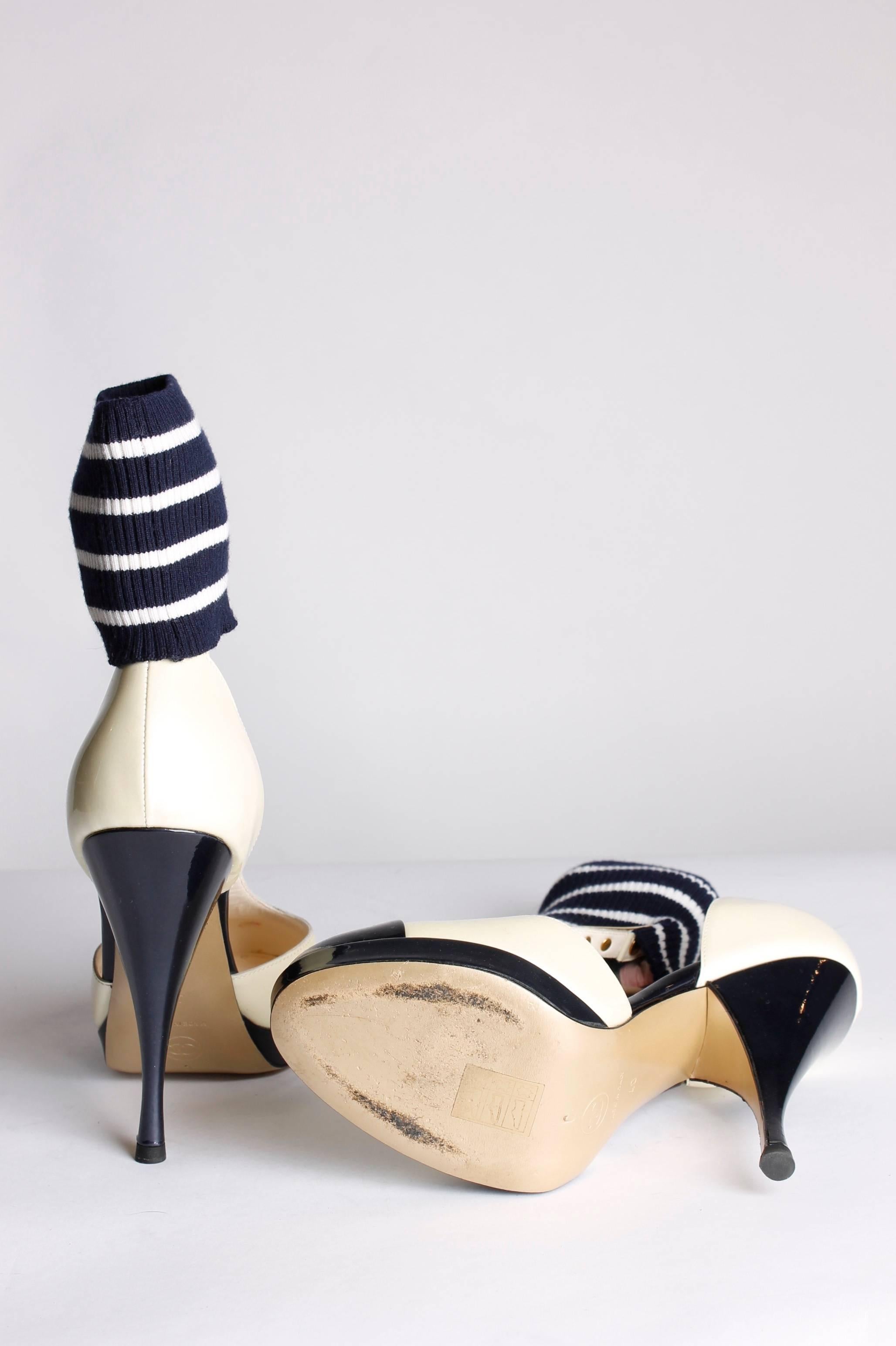 This pair is very special, Chanel pumps with a cuff around the ankle. Nice!

Made of patent leather in champagne cream and dark navy blue. A strap across the foot that holds a cuff. This knitted ankle cuff is striped in navy blue and white. An