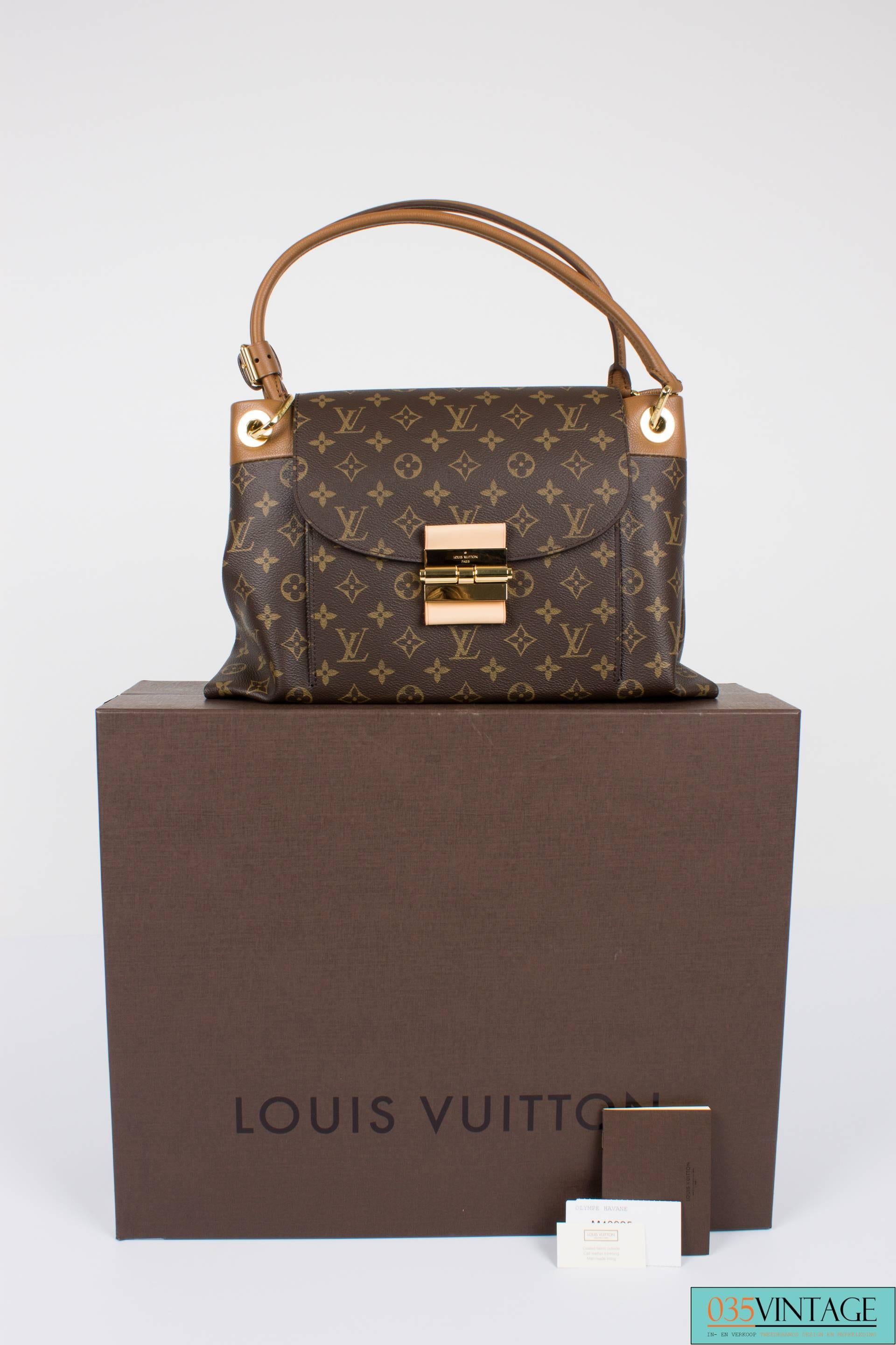 Louis Vuitton Monogram Olympe Bag

Brown Monogram Olympe Havane / Gold-Tone Hardware / Leather Dual Rolled HandlesLarge Exterior Zip Pocket At Back / Large Front Pocket At Interior / Brown Alcantara Interior / Three Compartments At Interior, One