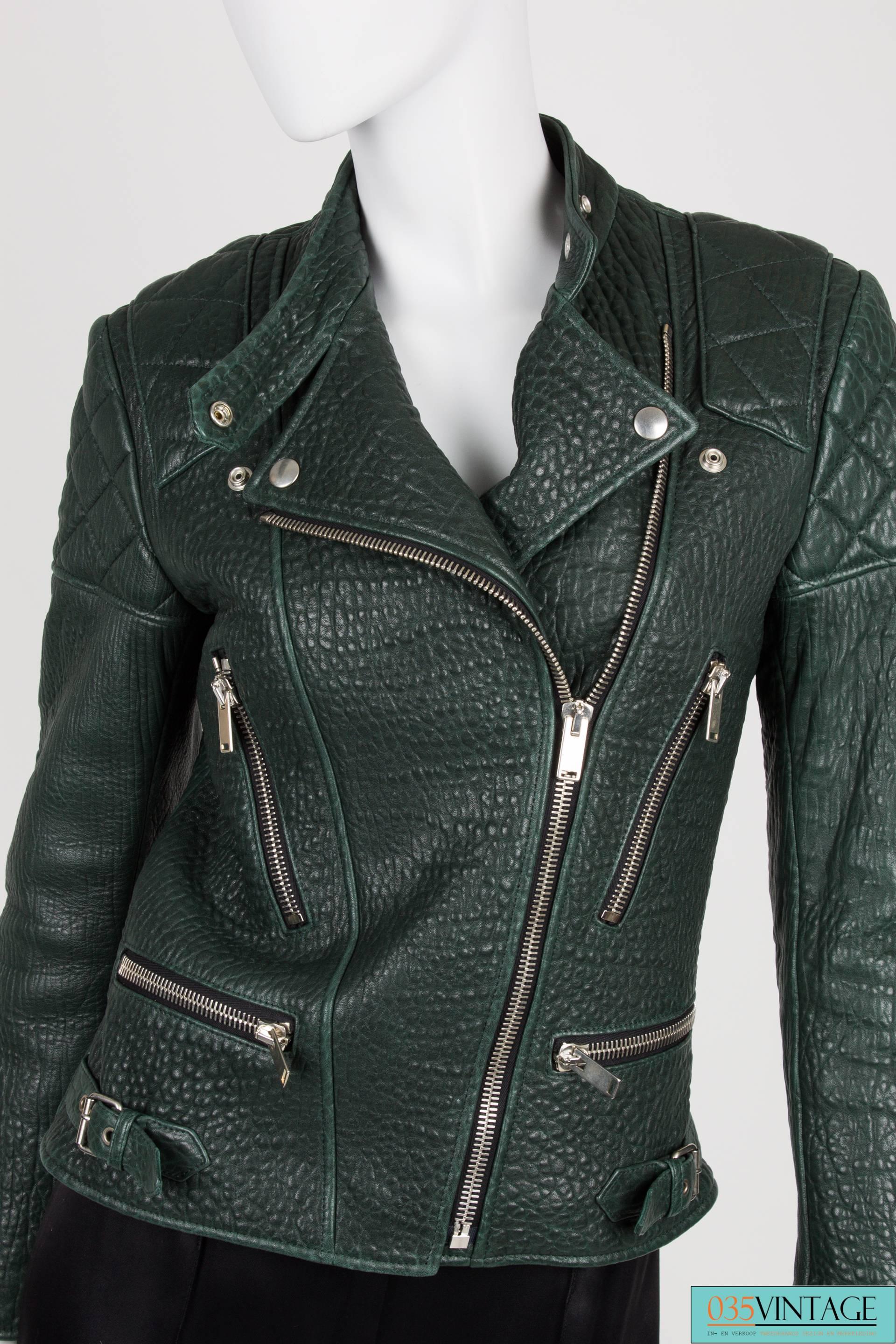 Very rare deep forest green shrunken kangaroo leather biker jacket designed by Phoebe Philo for CelineOn the shoulders, top of the back and elbows quilted pieces of leather for that extra tough look. Covered with silver zippers everywhere, also at