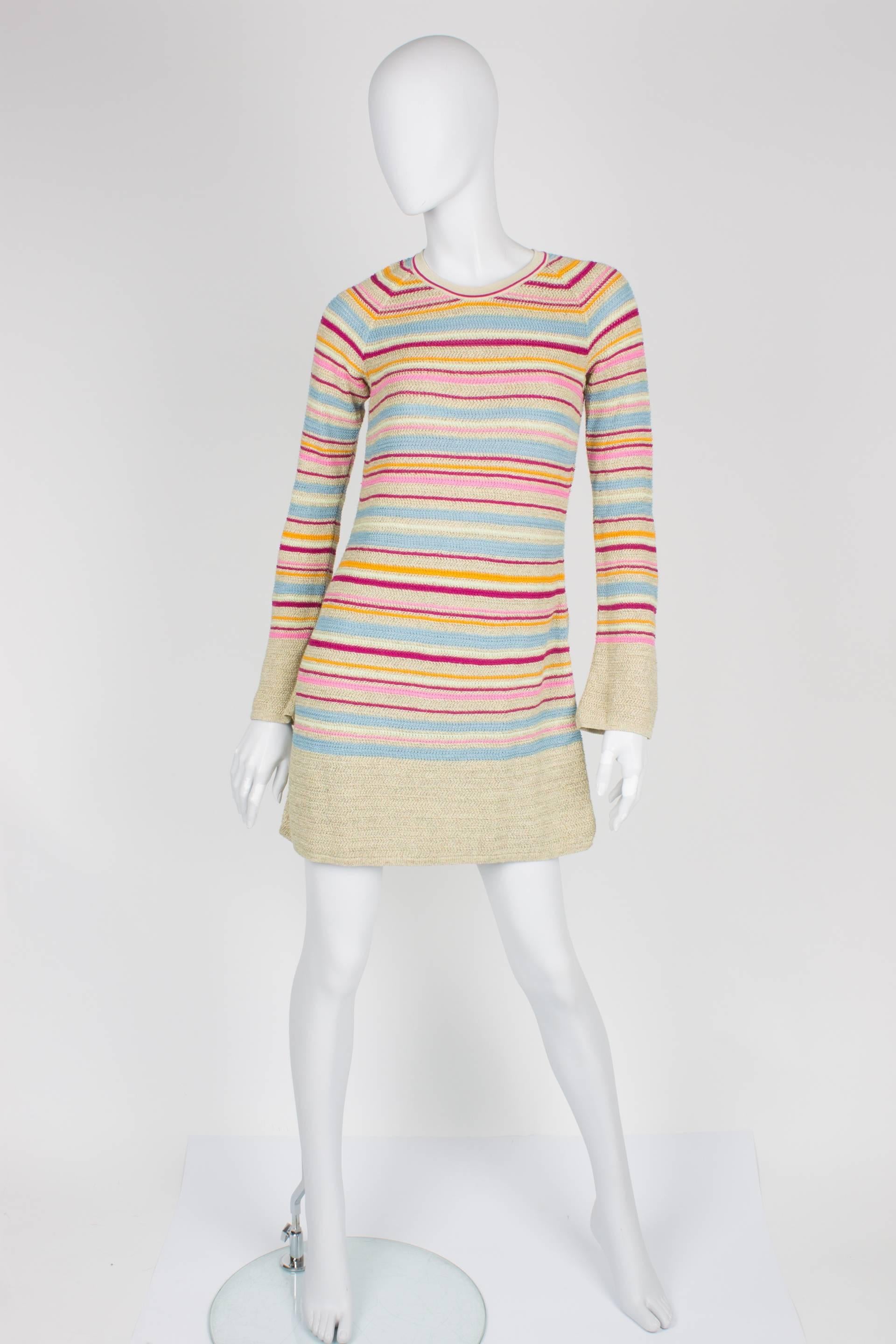 

Short dress by Chanel from the Resort Collection of 2011. We love the candy colors!

Long sleeved knit dress in multi-color: light blue, pink, orange and fuchsia. Some golden thread is added for extra glamour. No lining. Closure in the back of the