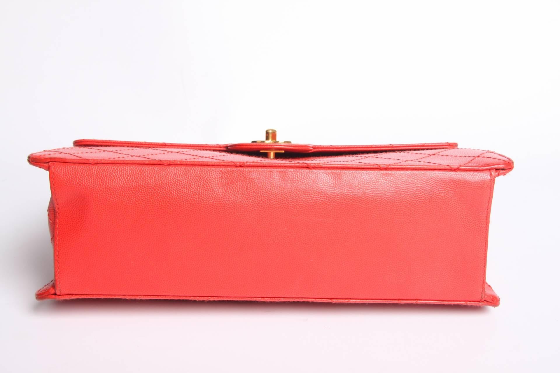 This red beauty by Chanel is a real eyecatcher!

A vintage Flap Bag, the serial number tells us it's from 1997/1999. A rather large size and super sturdy quality, the red caviar leather is still in excellent condition.

Gold-tone hardware, the CC