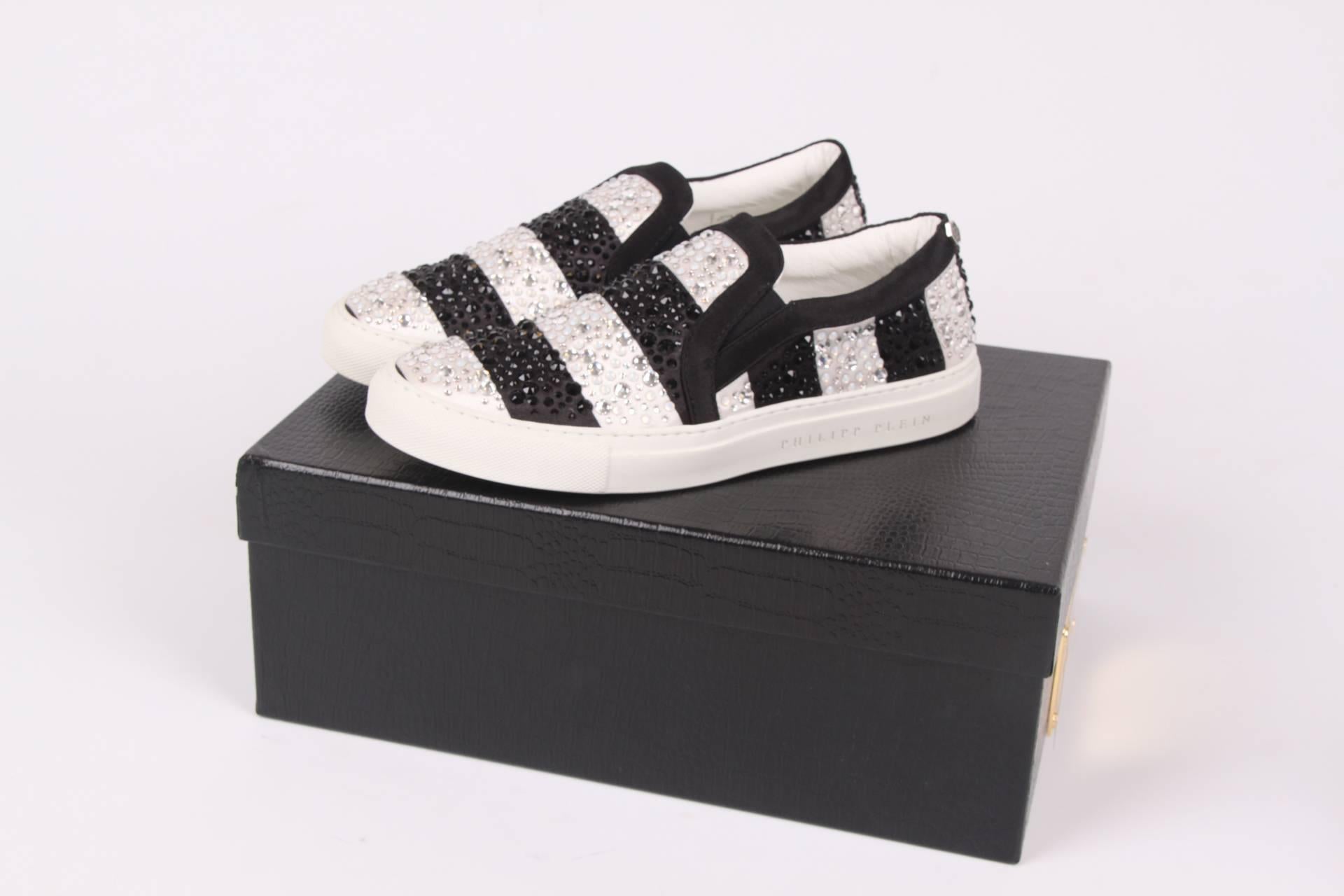 Limited edition Philipp Plein slip-on sneakers; coooool!!

Black/silver striped slip-ons covered with Swarovski crystals in black and silver. The outsole is crafted in white rubber, inside lining in white rubber.

The crystals are hand embroidered
