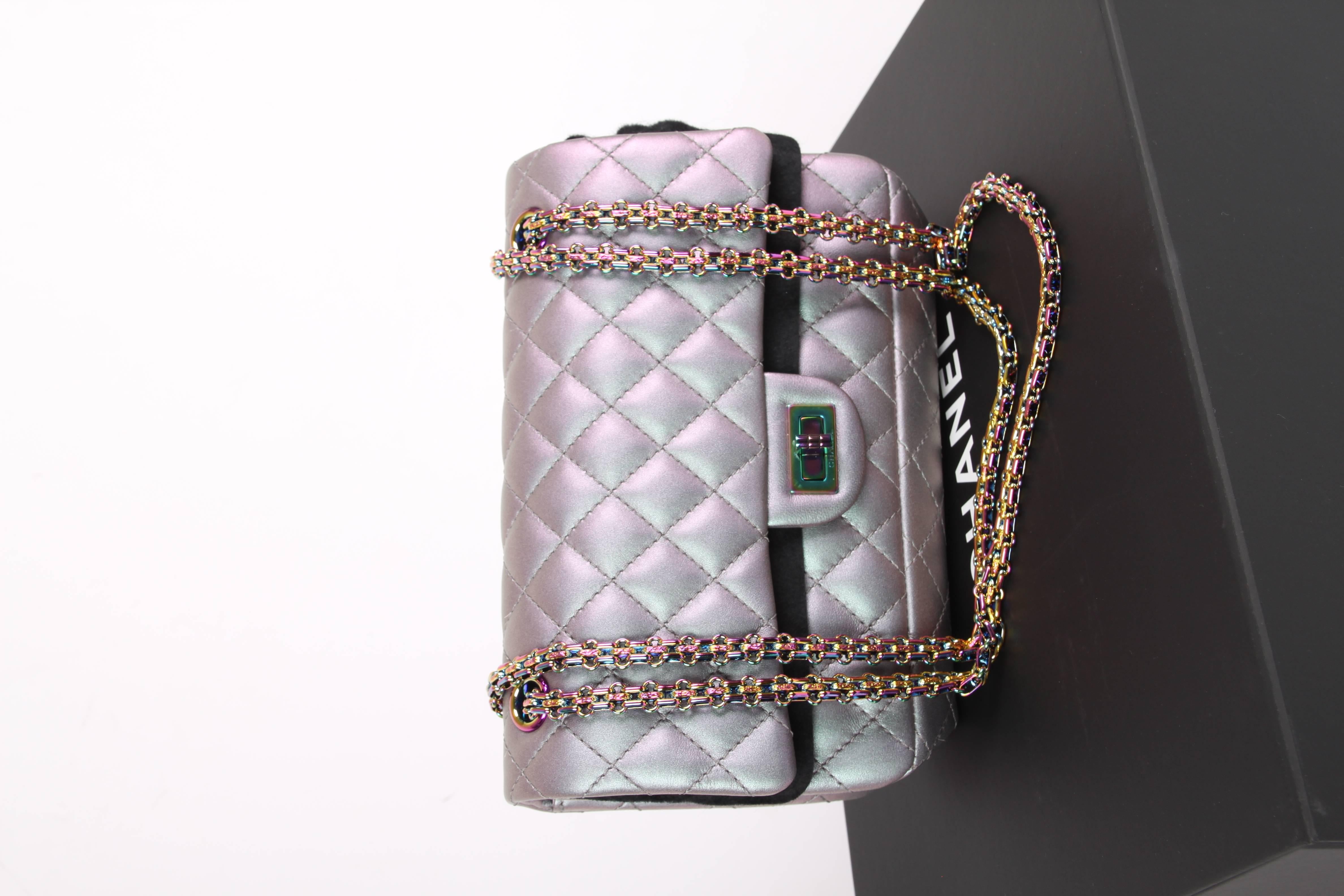 Ooooh, so beautiful! The Chanel Medium 2.55 Reissue Double Flap Bag in metallic lilac coloured leather with a rainbow finish; Iridescent Mermaid. 

One of the most wanted bags of Chanel is the Reissue-line. Thick and resilient stitched leather that