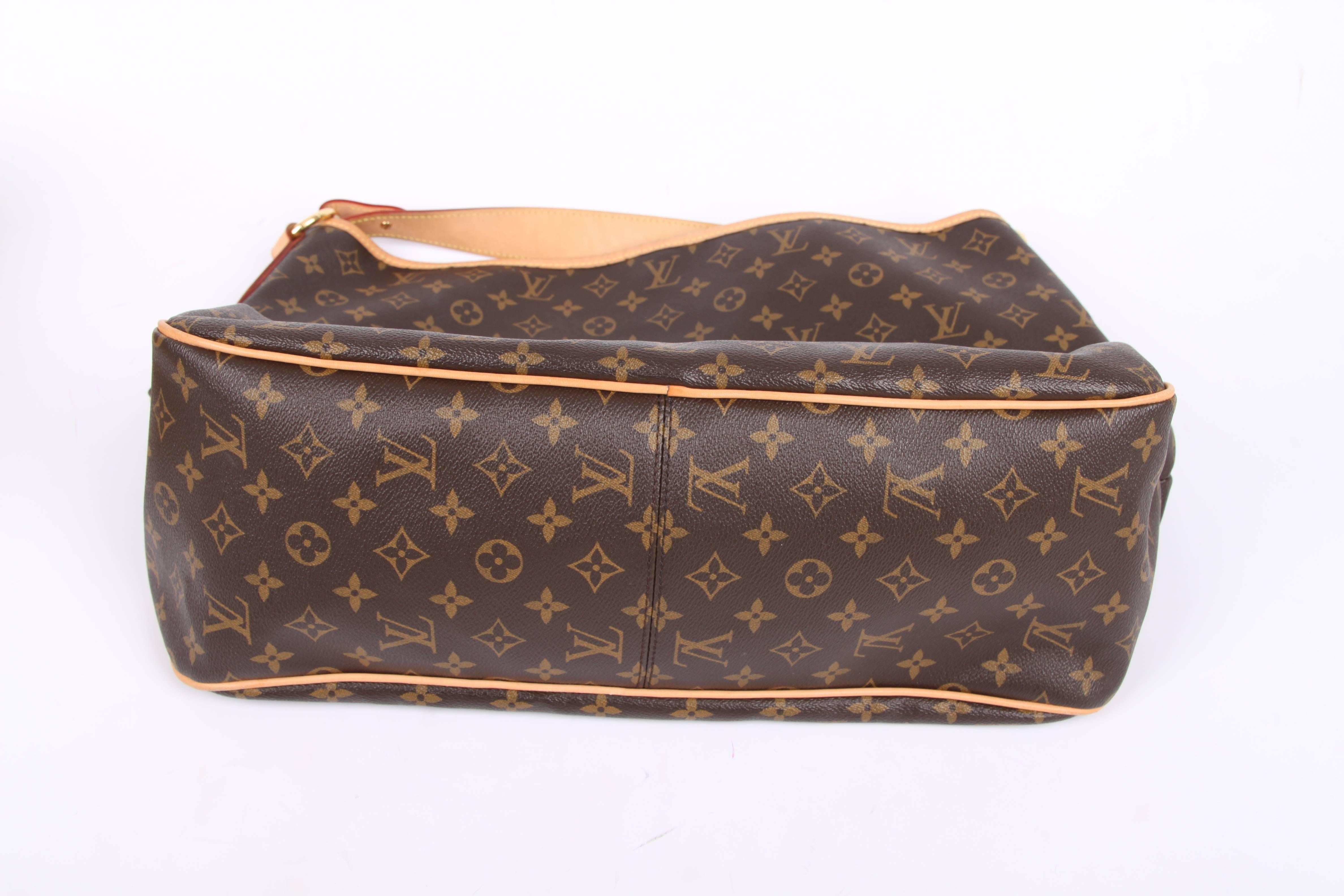 Great alternative to the Louis Vuitton Neverfull Bag, it fits just as much, and this one is called Delightful! Very pretty!

Of course crafted of dark brown canvas covered with numerous monograms, detailing in natural cowhide leather. A wide