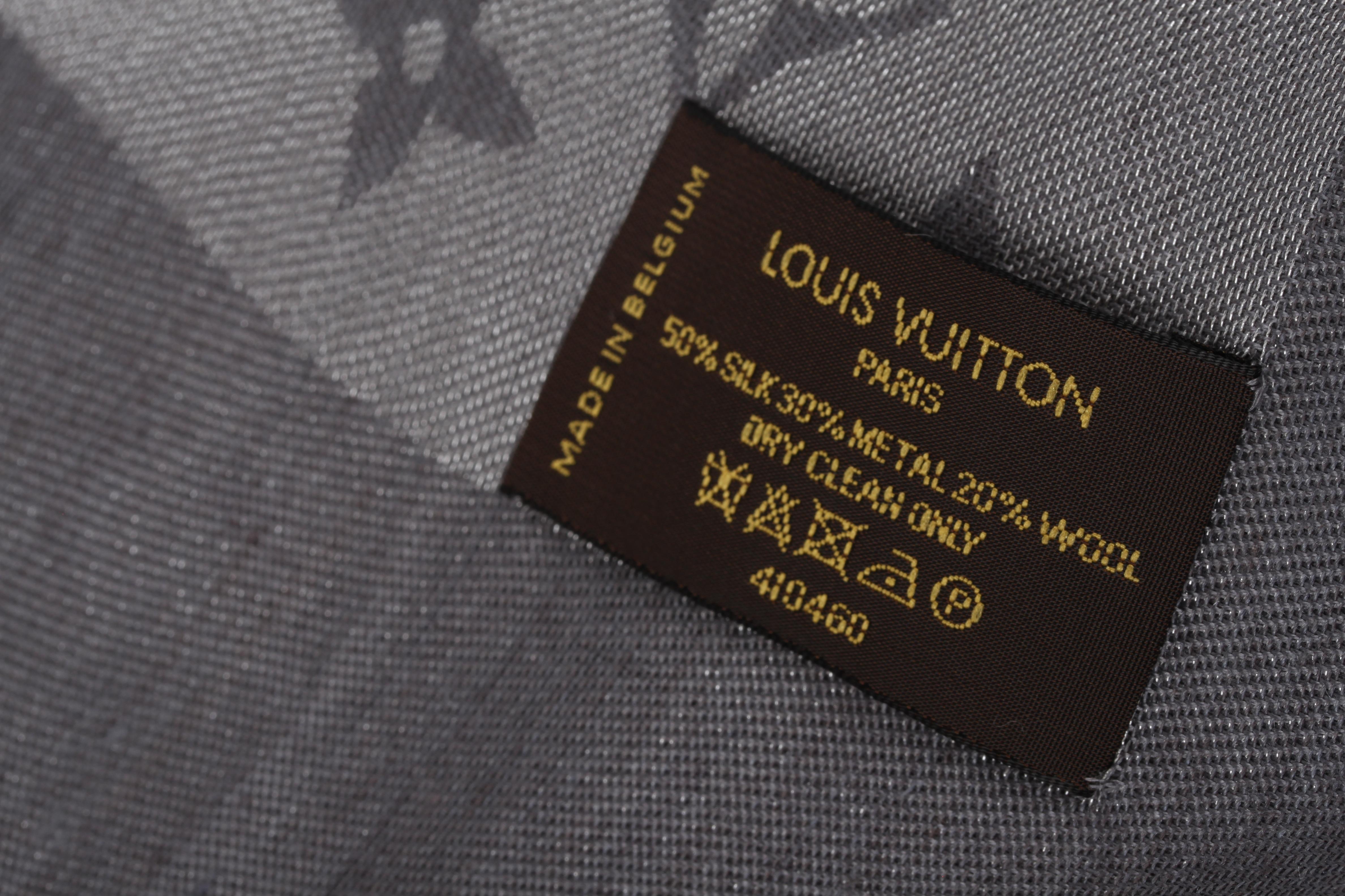 Rather large scarf by Louis Vuitton in black and silver.

This shawl measures as much as 140 x 140 centimeter and is covered with Louis Vuitton Monograms. Very sophisticated design, the silver part has a subtle shine. Fringe trimming.

Maybe worn