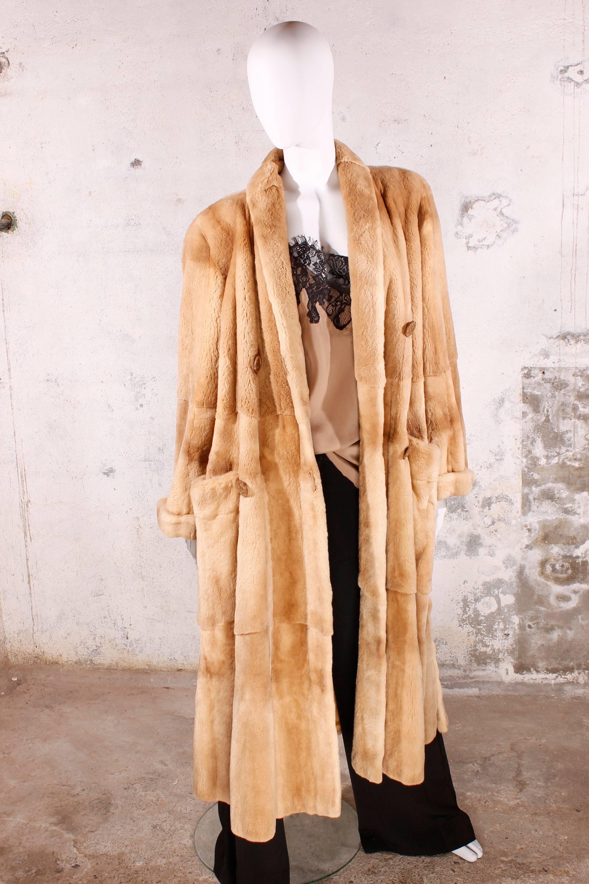 A beautiful long fur coat from the farm of Saga. These minks are ranched and this colour is very special. It's called Palamino mink, which is a lighter shade of beige mink. The skins are all uniform in colour with a slight darker marking along the