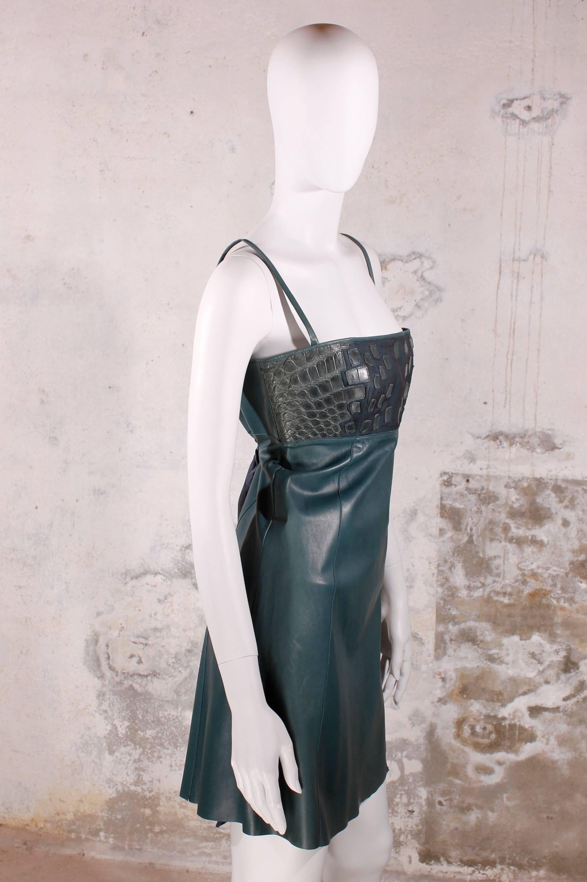 This Jitrois dress is made of leather and silk. 
Really soft lambskin leather in green and the upper part has pieces of genuine crocodile leather. This croco leather is used in larger pieces, but it is also used in small pieces stitched on the silk