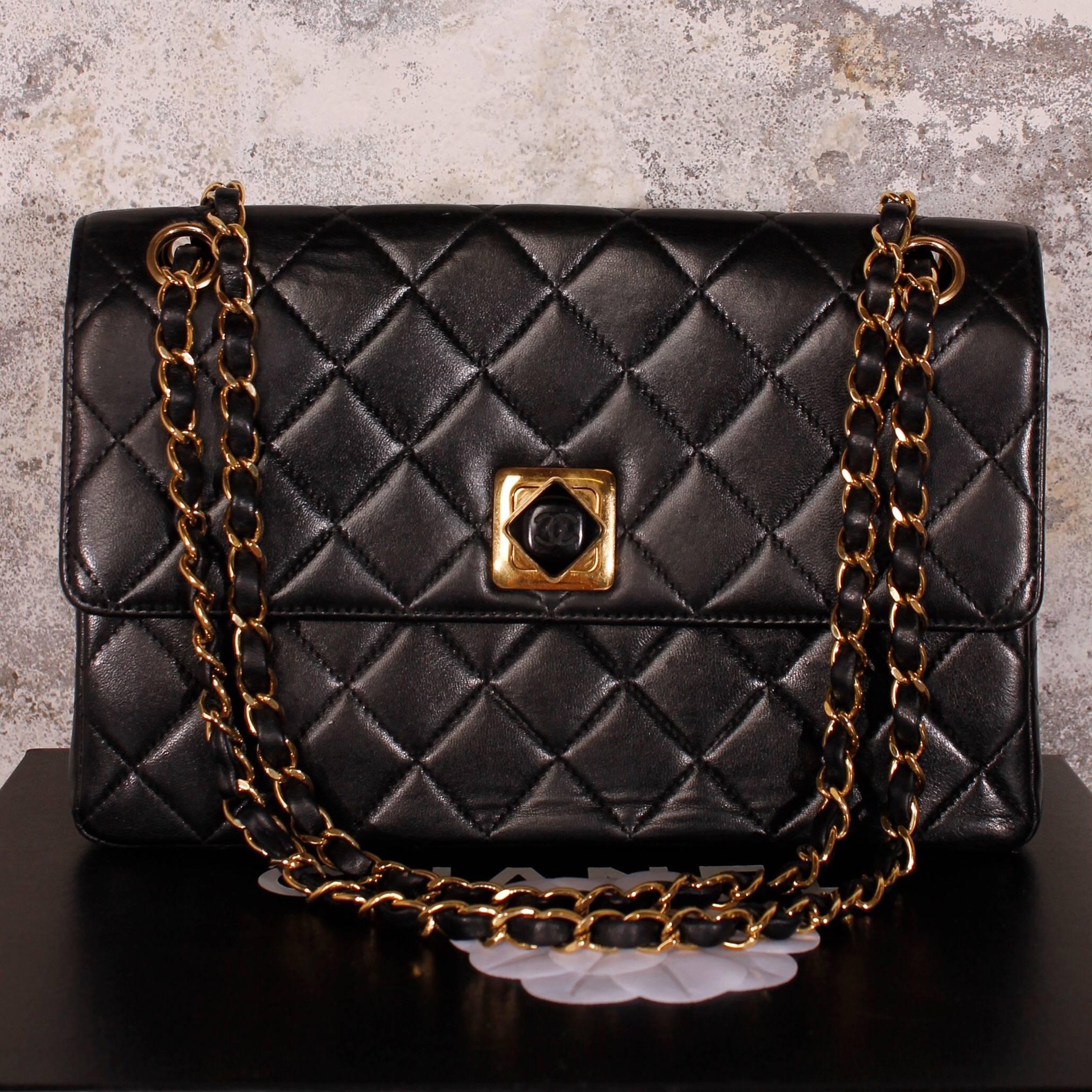 This one is very very special! A 1997 limited Chanel 2.55 Bag with a very rare closure and single flap. A really nice bag, we must say!

In excellent condition, the soft lambskin leather is free of damages and intensely black. Golden hardware: