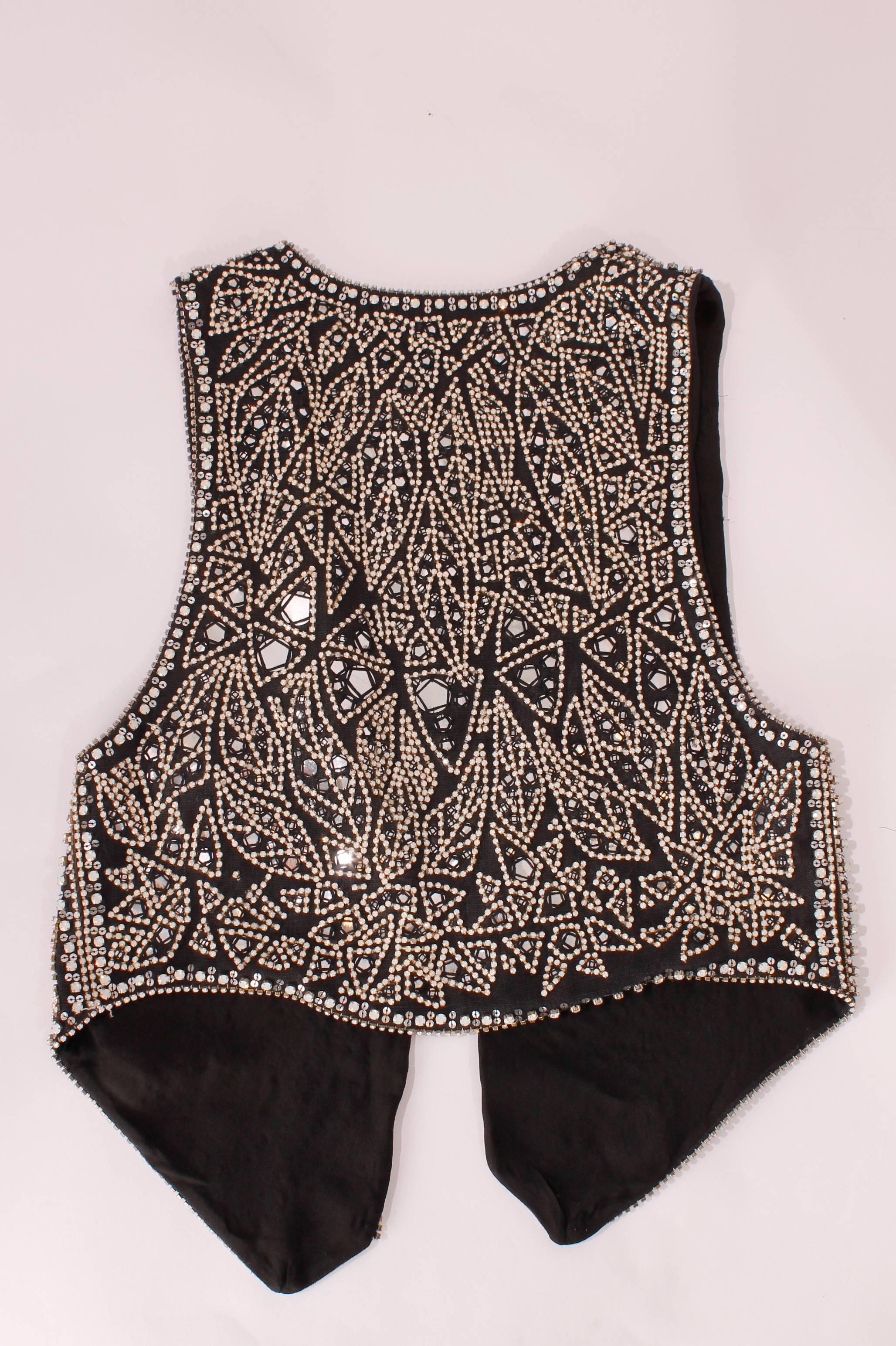 Black linen vest with a white and silver stone studded design. 

French size 38

Never worn