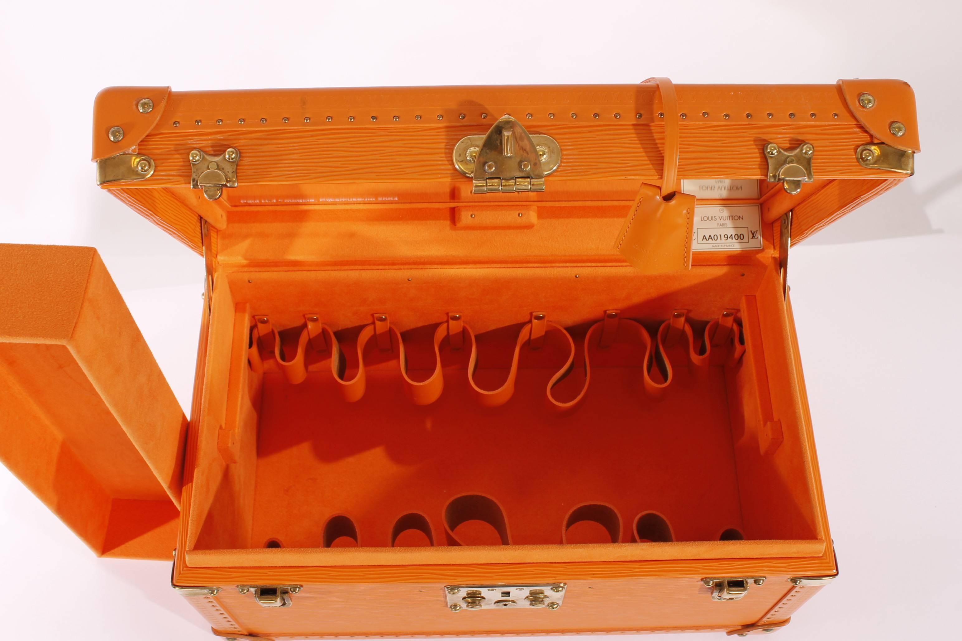 Very rare! Louis Vuitton Vanity case in a beautiful and very warm shade of orange.

These colored Cosmetic Trunks in leather are only available by special order, never sold in any LV store worldwide. So far we have
seen a red, blue and green one,