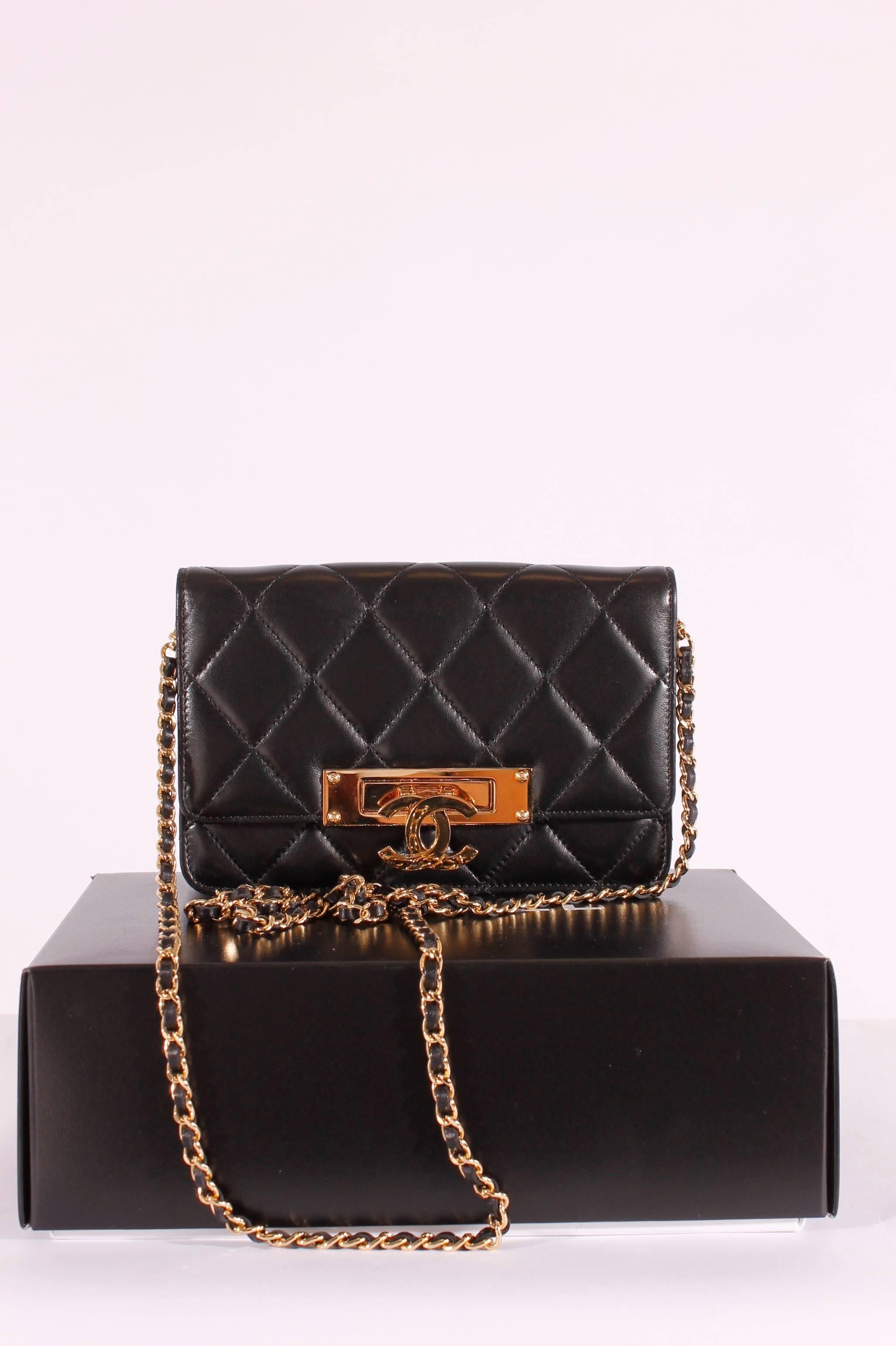 This little beauty is not a wallet-on-a-chain, but very comparable to the WOC collection. This is the Chanel Golden Class Double CC Bag from the Cruise Collection of 2014, very very nice!!

Made of soft black quilted lambskin leather with golden