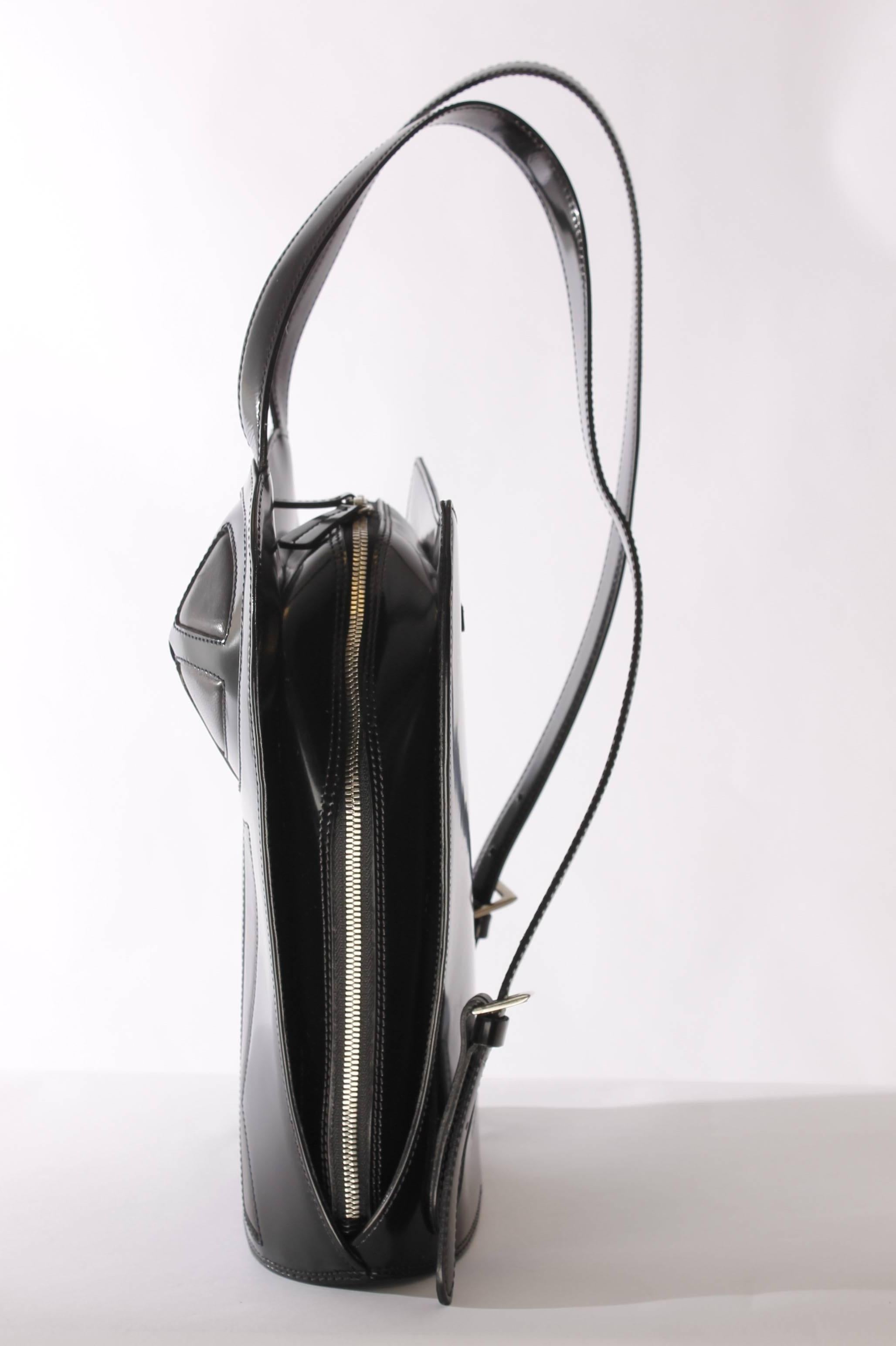 Unique and rare backpack by Jean Paul Gaultier, reminiscent of Madonna's Blond Ambition tour.

Made of shiny black hardshell leather, at the front the well known bustier Madonna wore during her tour. A very beloved vintage item from 1998. Two