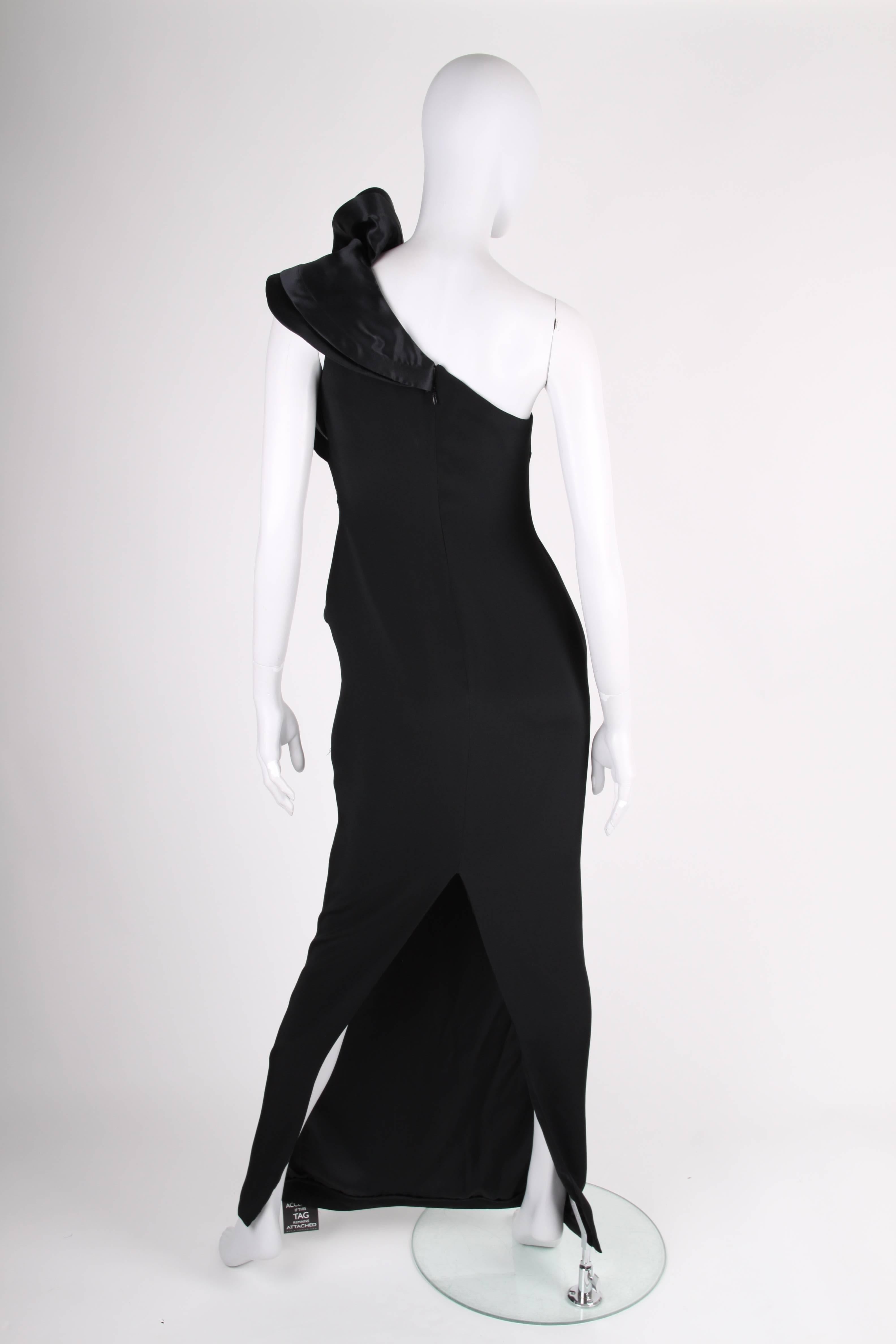 Out of this world, so incredibly beautiful! One-shoulder dress by Marchesa Notte in black silk.

Embellished with an XL ruffle on the shoulder and at the front. Fully lined. Has ankle-length and a rather large slit on the back.

In perfect