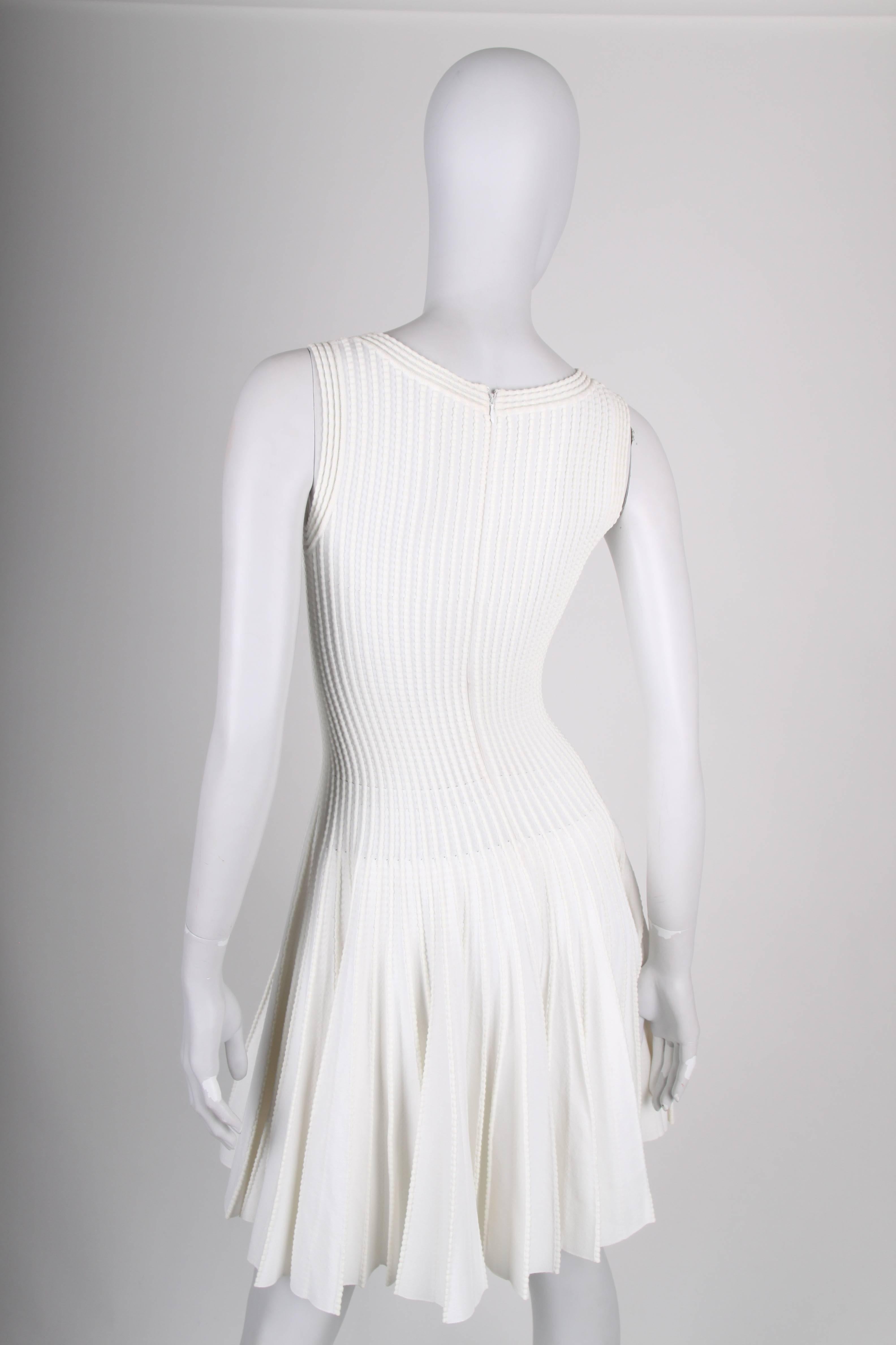 This is a stunning beauty by ALAIA!

Sleeveless dress with a long zipper on the back. Round neckline and a wide pleated skirt. Very comfortable to wear due to the stretching material.

In very good condition, 9/10

Material: 50% viscose, 30% cotton,
