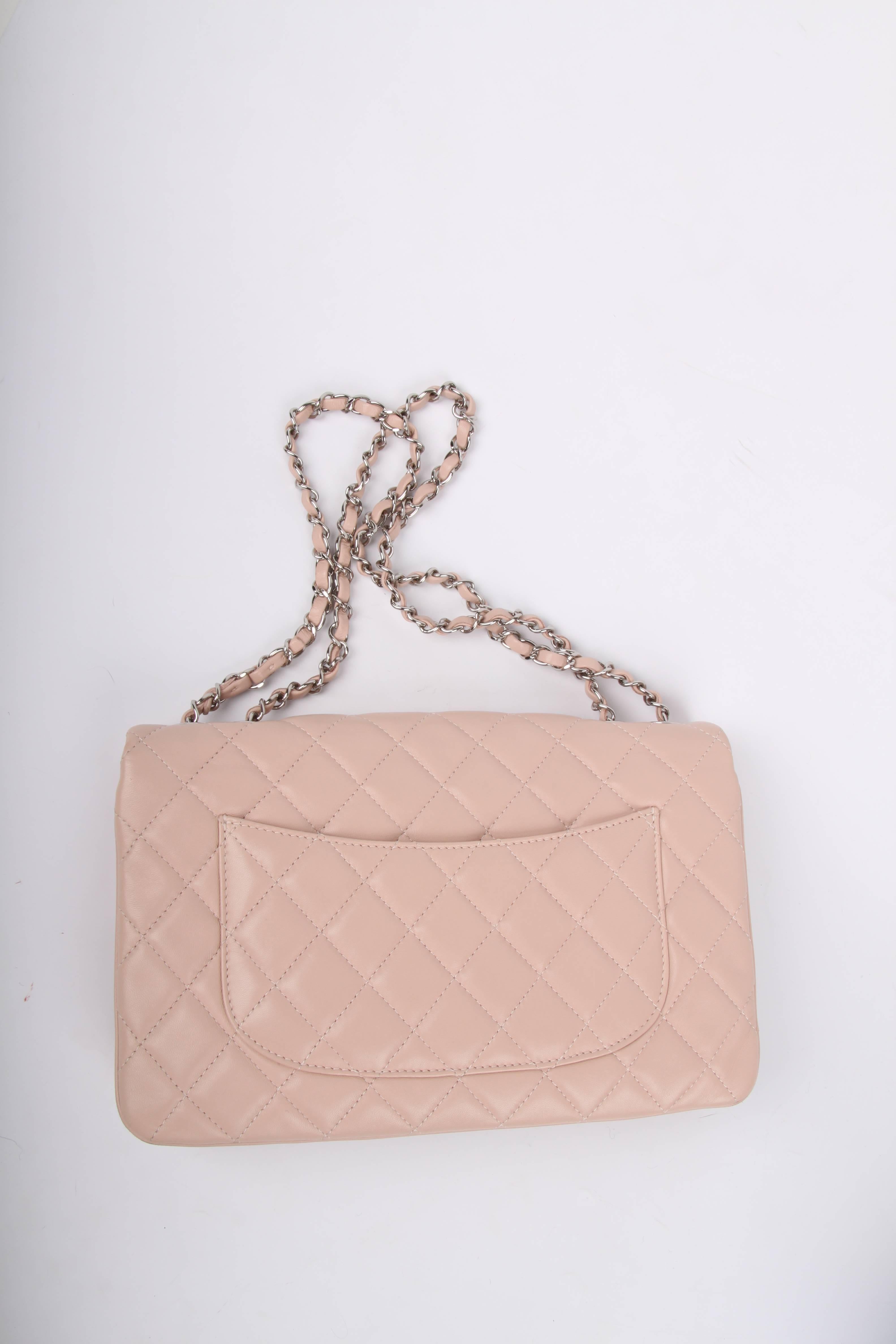 This highly sought after bag is called Chanel 3 Flap Bag. We love it.

The name says it al; it has three compartments, immediately visible on the exterior. The bag is crafted from soft lambskin leather in very light shade of pink. Silver-tone