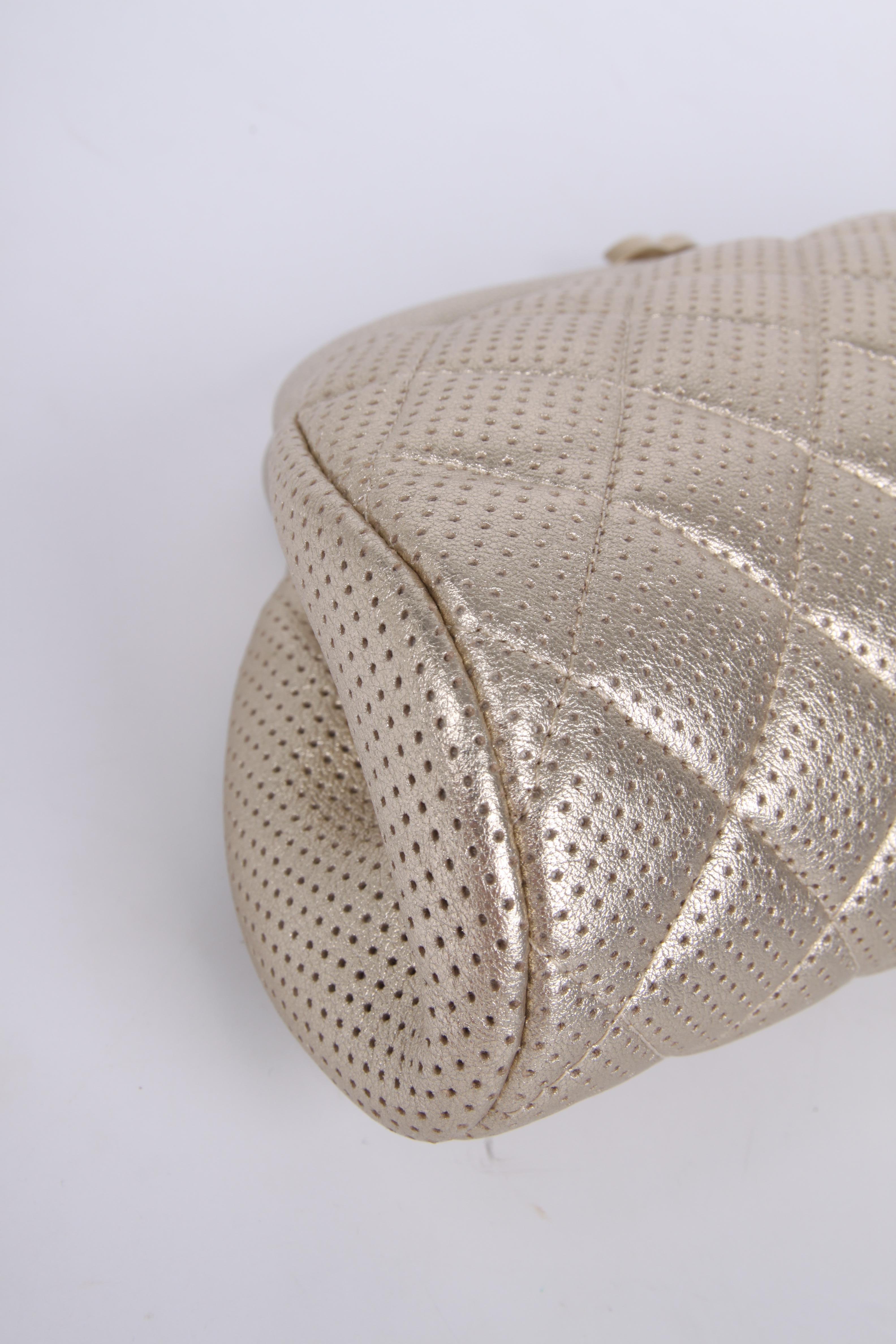 Allure alert! This Timeless Classic Clutch by Chanel is sooo chic!

Crafted from perforated and quilted gold-tone leather, top closure with a matte golden CC lock. Interior lining in metallic golden coloured smooth leather. One zip pocket. 

In