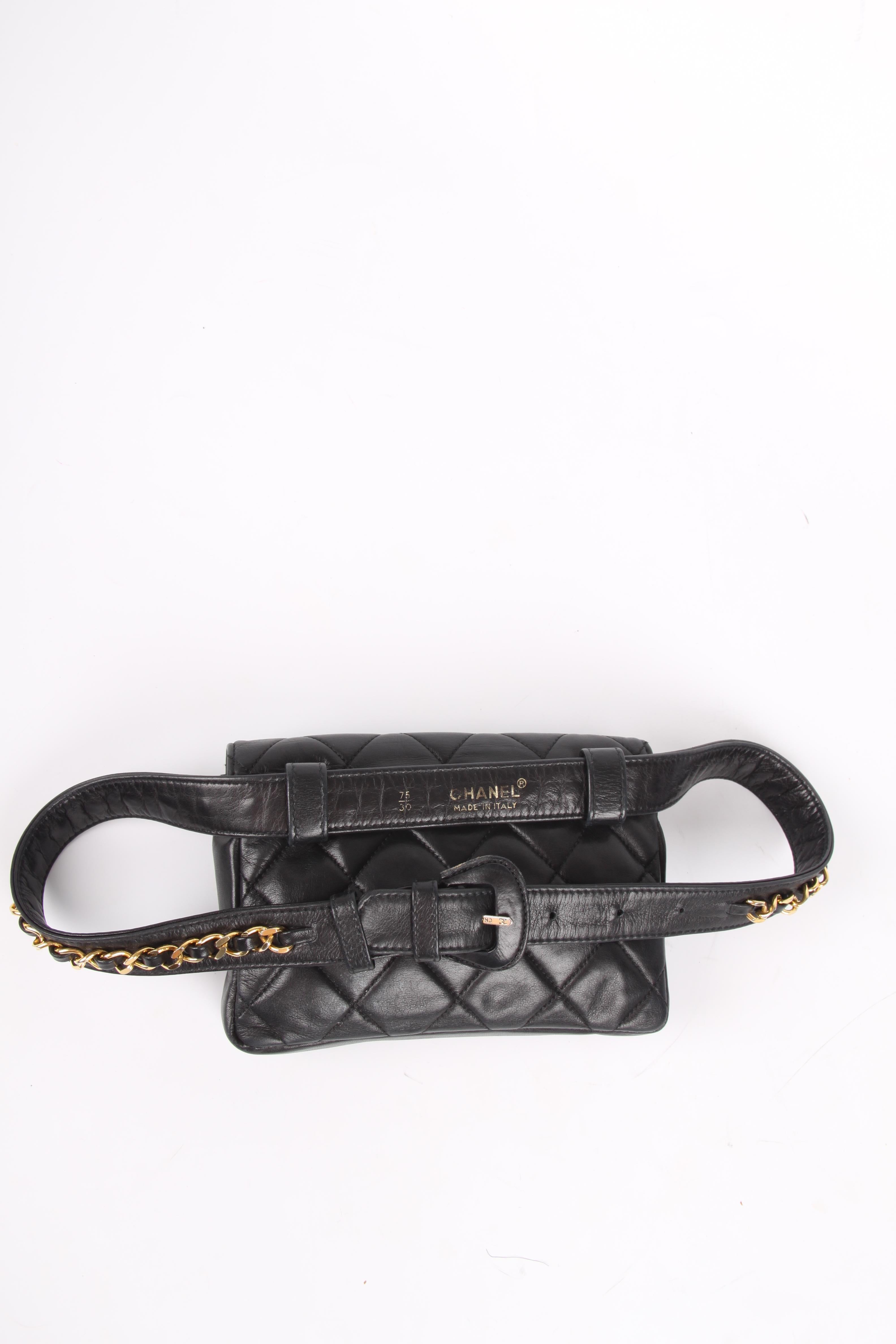 Vintage Chanel Belt Bag with matching belt embellished with a gold-tone chain. 

Quilted smooth calfskin leather, turnlock CC closure at the front. One flat pocket with a zipper, lining in black leather.

Belt: black leather and black leather