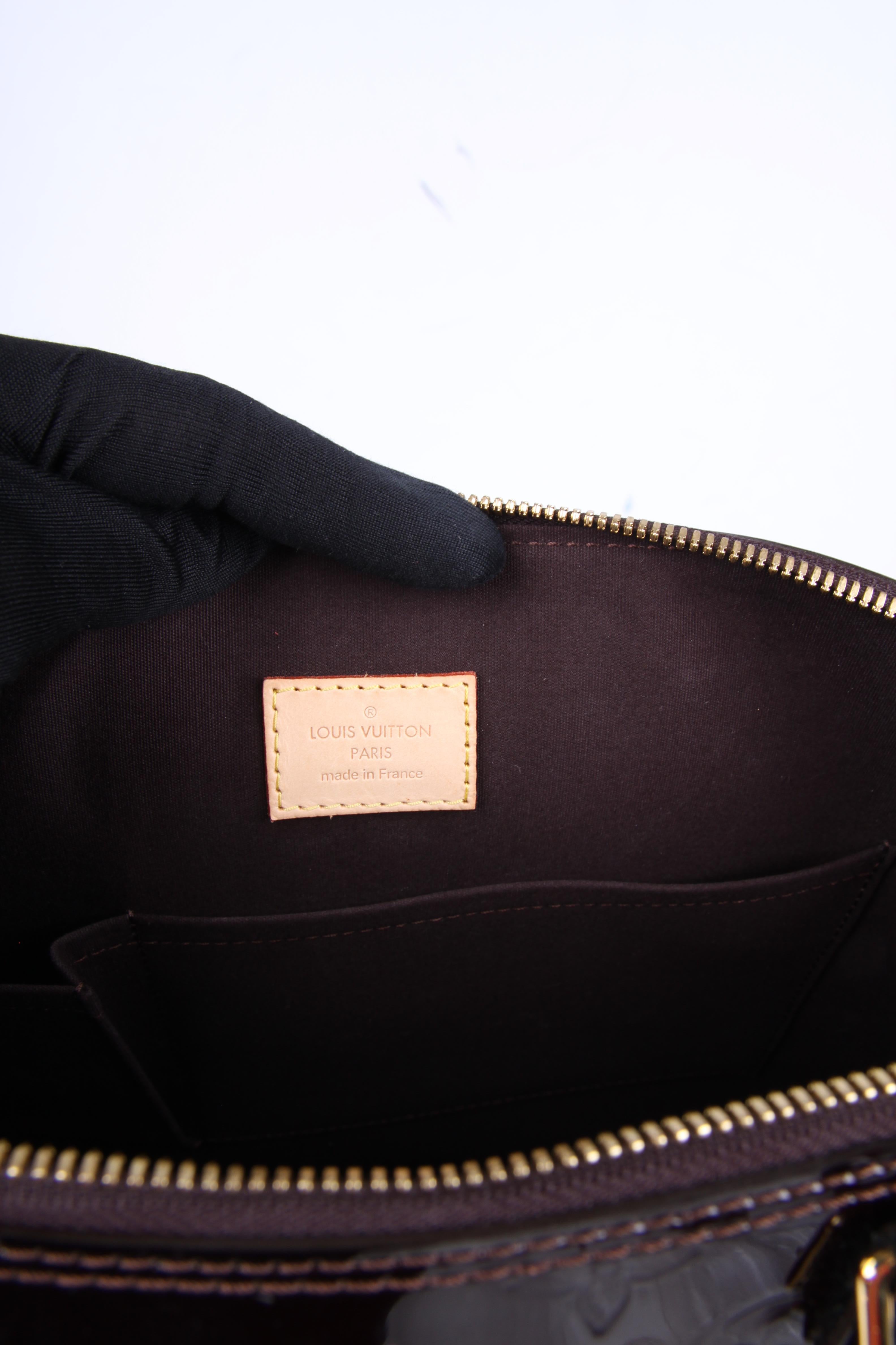 burgundy patent leather handbag