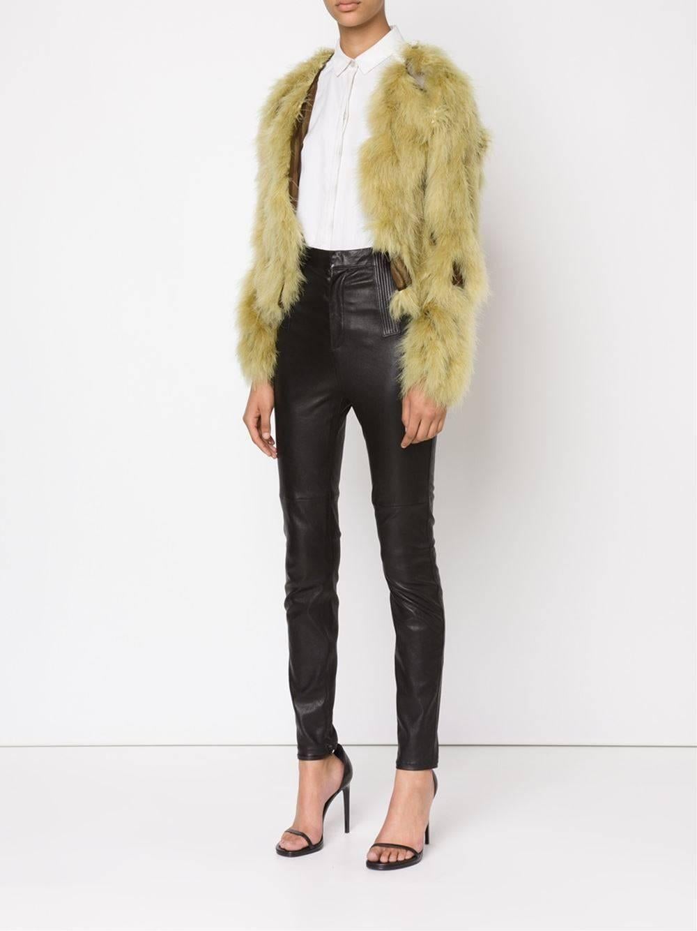 Cropped and frisky ostrich feather fur coat by Jean Paul Gaultier in lime green, this one stands out!

This jacket is ultralight, it weighs almost nothing. Made of diaphanous army green silk on which the fur is attached. A tie fastening at the round