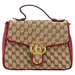 Bolso Gucci GG Marmont Mini, de lona GG beige con asa superior de piel roja