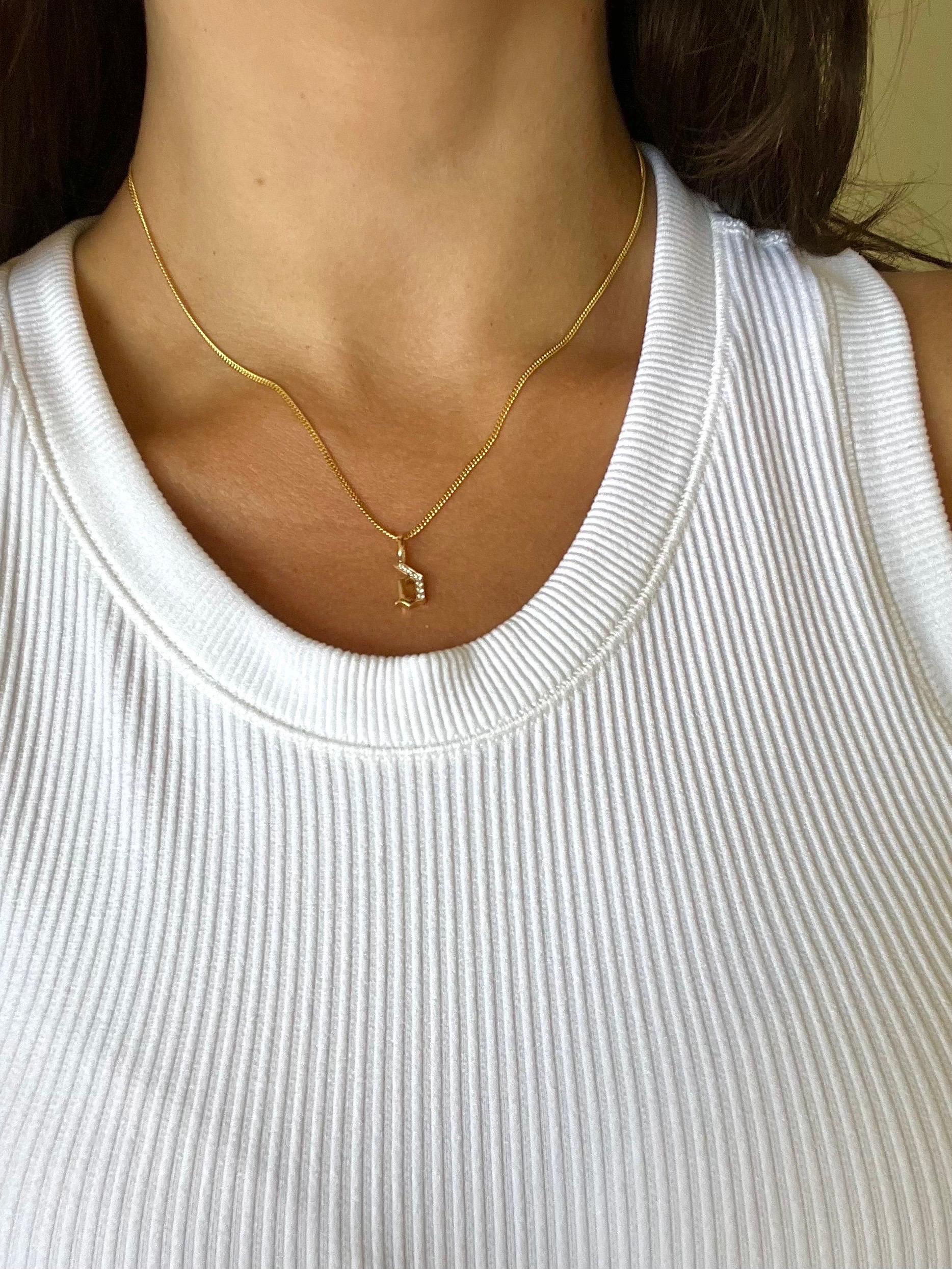 LIMITED TIME SUMMER SALE

This exquisite solid 14k gold curb chain and gothic style diamond initial strikes the perfect harmony between bold presence and refined minimalism. Featuring a bespoke hand-pavé double-sided diamond clasp, it offers