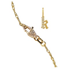 Ciondolo con iniziale "k" in oro 14k con diamante e catena sovrapposta con chiusura a diamante